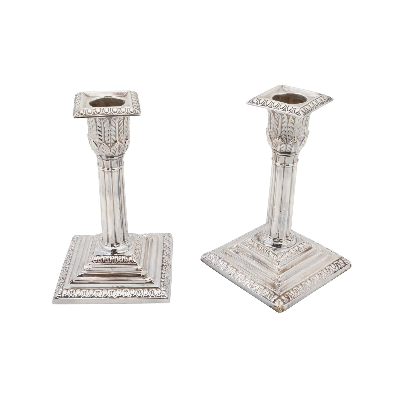 Sheffield 1909 by Henry Atkin A pair of Edwardian sterling silver dwarf or desk candlesticks: Sheffield 1909 by Henry Atkin A pair of Edwardian sterling silver dwarf or desk candlesticks Stepped square bases, fluted columns, removable sconces. Each filled. (2) Height -13.9 cm / 5.5 inches