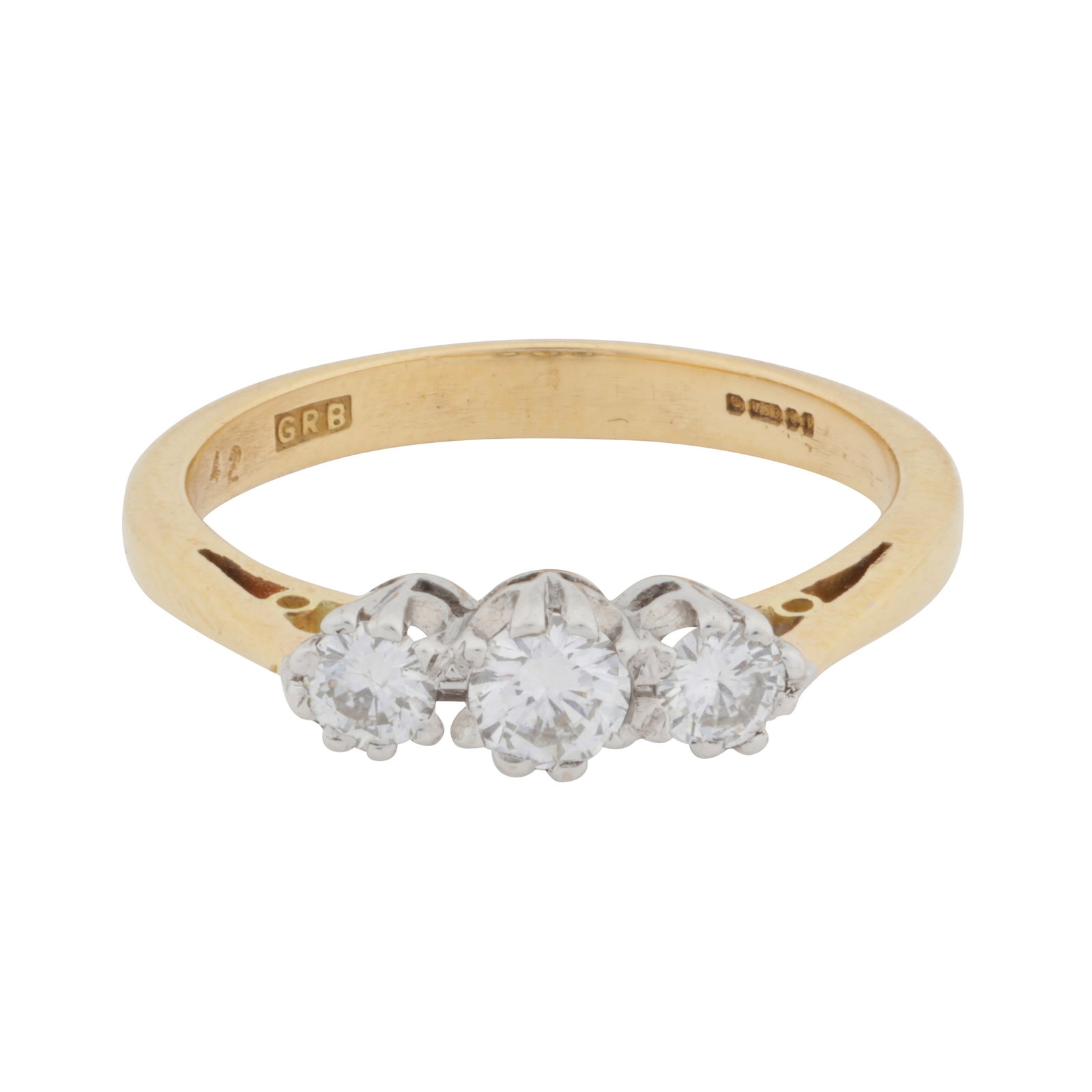 A three-stone brilliant cut diamond ring, circa 1995 18 carat yellow and white gold: A three-stone brilliant cut diamond ring, circa 1995 18 carat yellow and white gold Set with graduated brilliant-cut diamonds, mounted in 18 carat yellow and white gold, diamonds approx. 0.40 carat