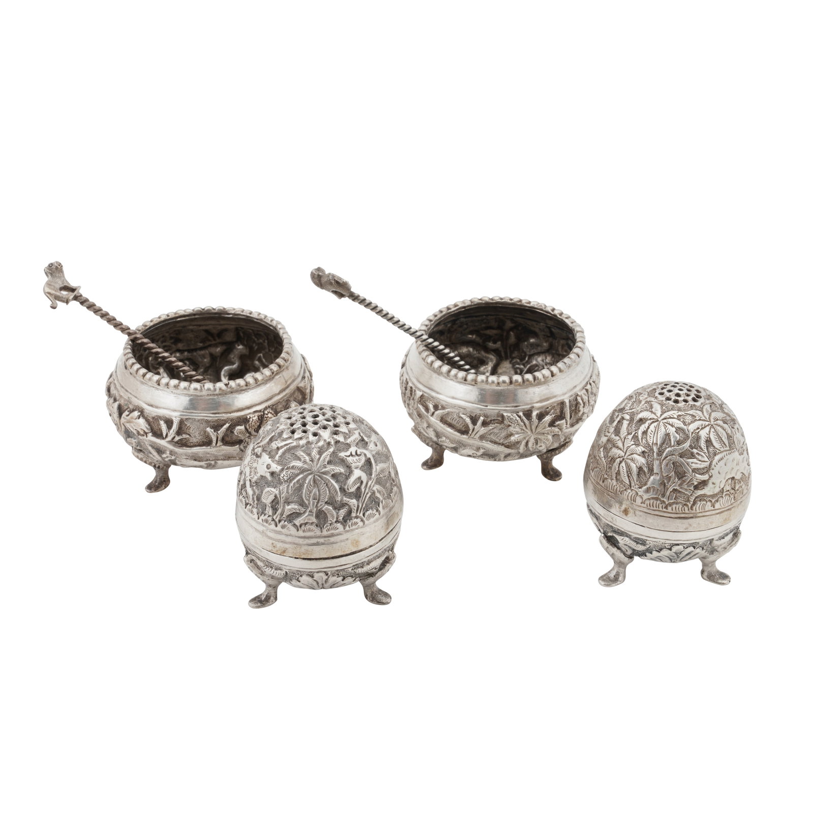 Lucknow circa 1920 An early 20th century Anglo-Indian unmarked silver cruet set: Lucknow circa 1920 An early 20th century Anglo-Indian unmarked silver cruet set Raj period. Comprising a pair of salts, a pair of pepper pots, and two salt spoons made from ¼ Rupee coins. Chased