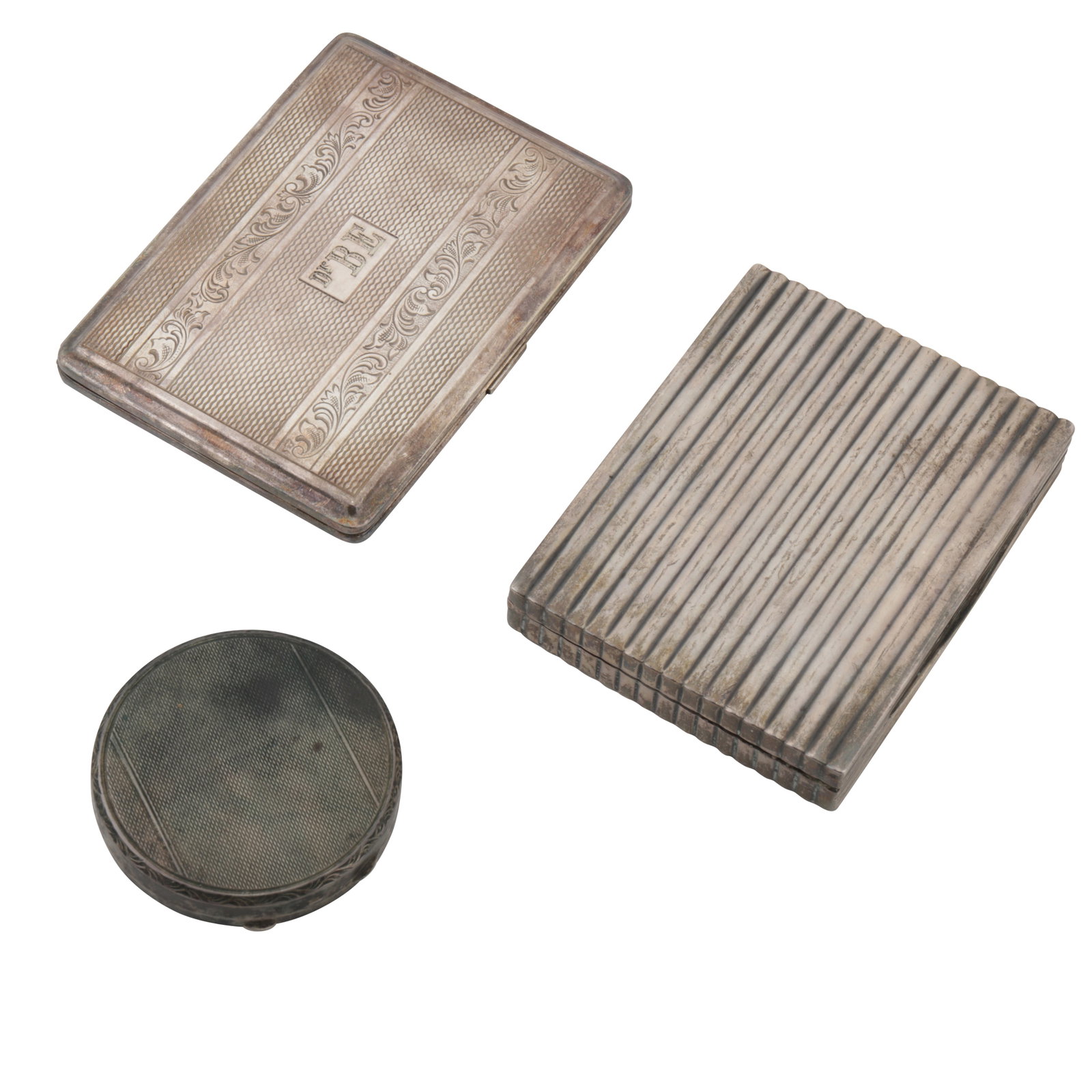 Budapest circa 1930 by AG An early 20th century 800 standard silver cigarette case: Budapest circa 1930 by AG An early 20th century 800 standard silver cigarette case Rectangular form. Together with a compact and a base metal cigarette case. (3) Weighable silver - 159 grams / 5.11