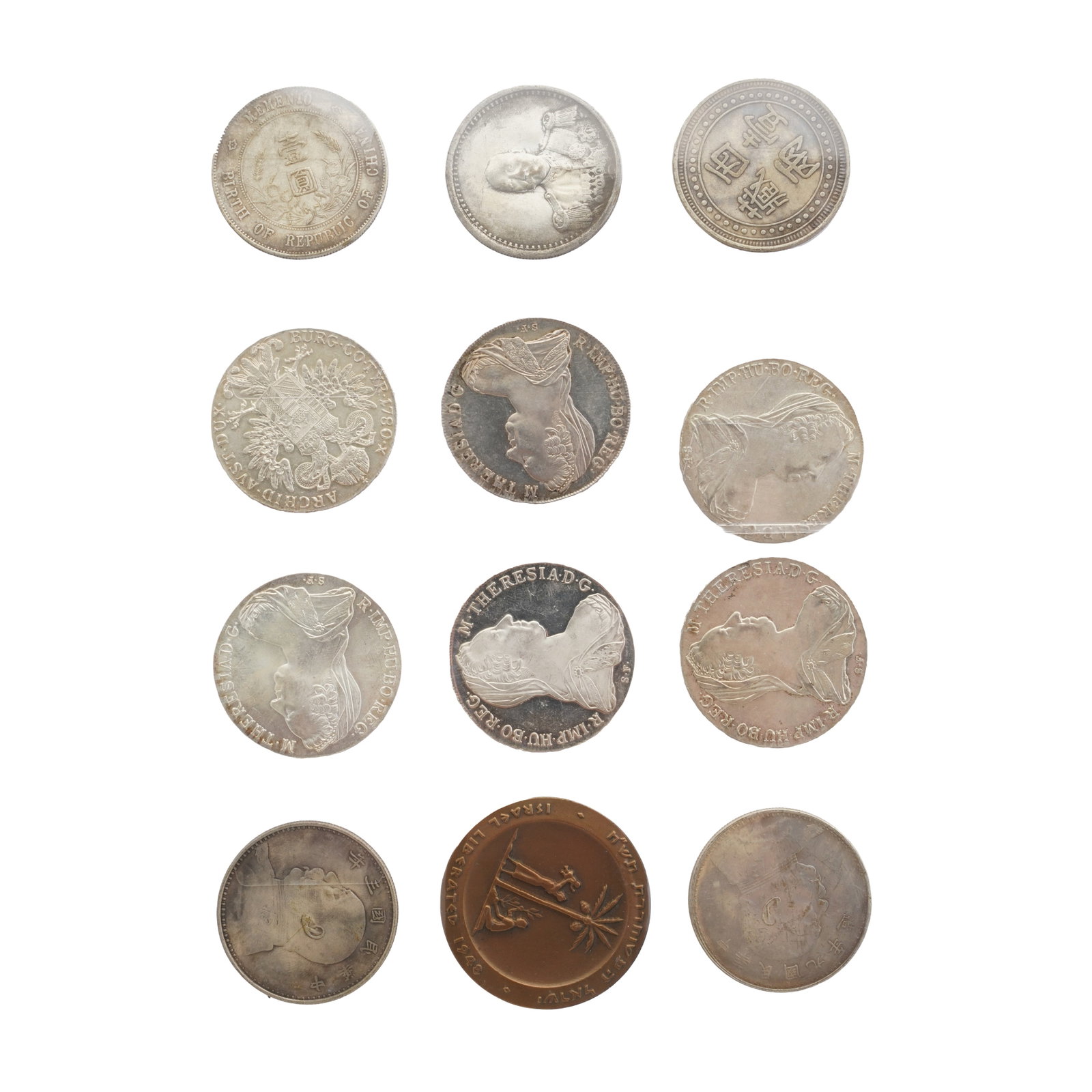 A large folder of coins to include silver examples. - 12