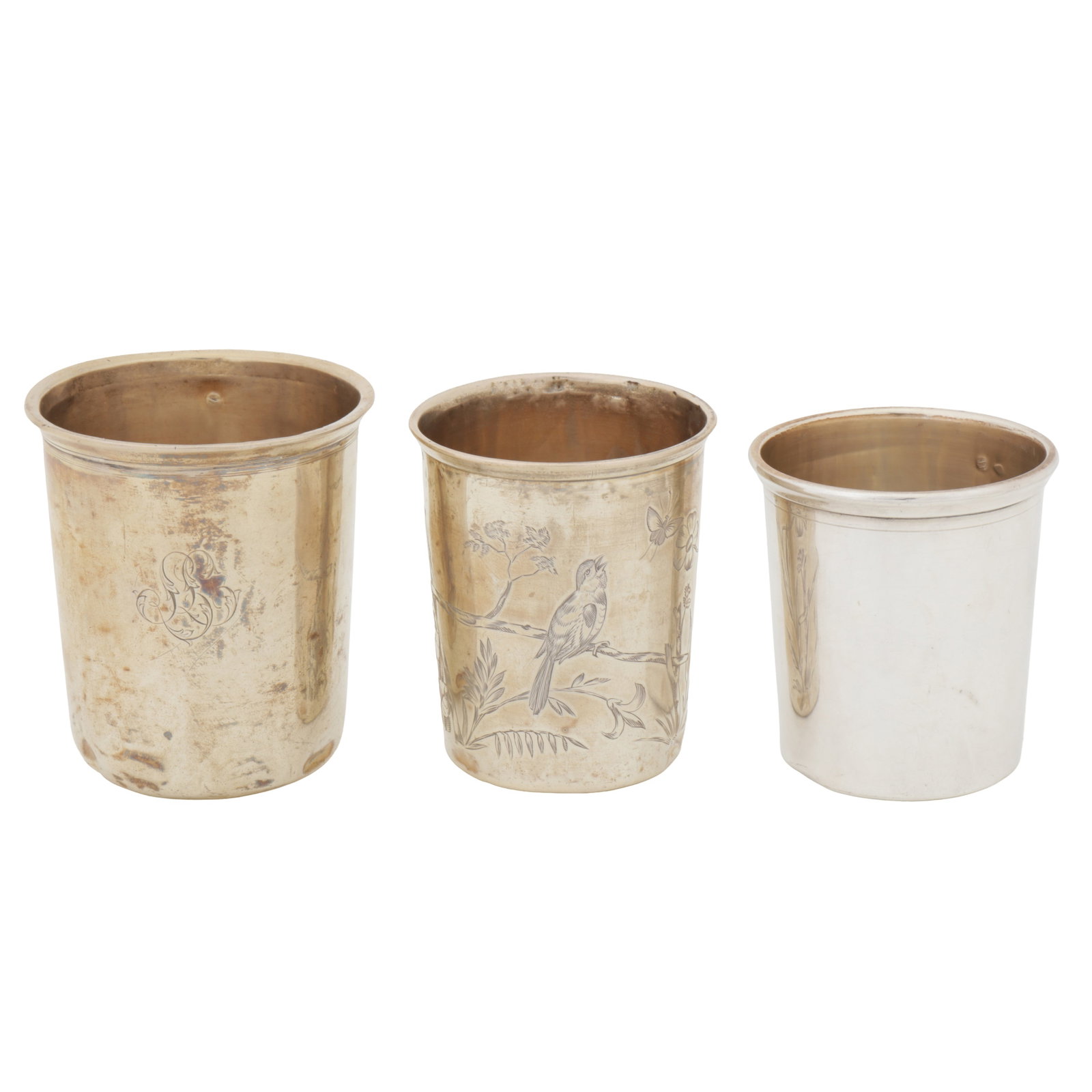 Three French 950 standard silver beaker: Three French 950 standard silver beaker Each of tapering cylindrical form with moulded rim, one with engraved foliage and bird decoration (3) Weight -241 grams / 7.75 ozt