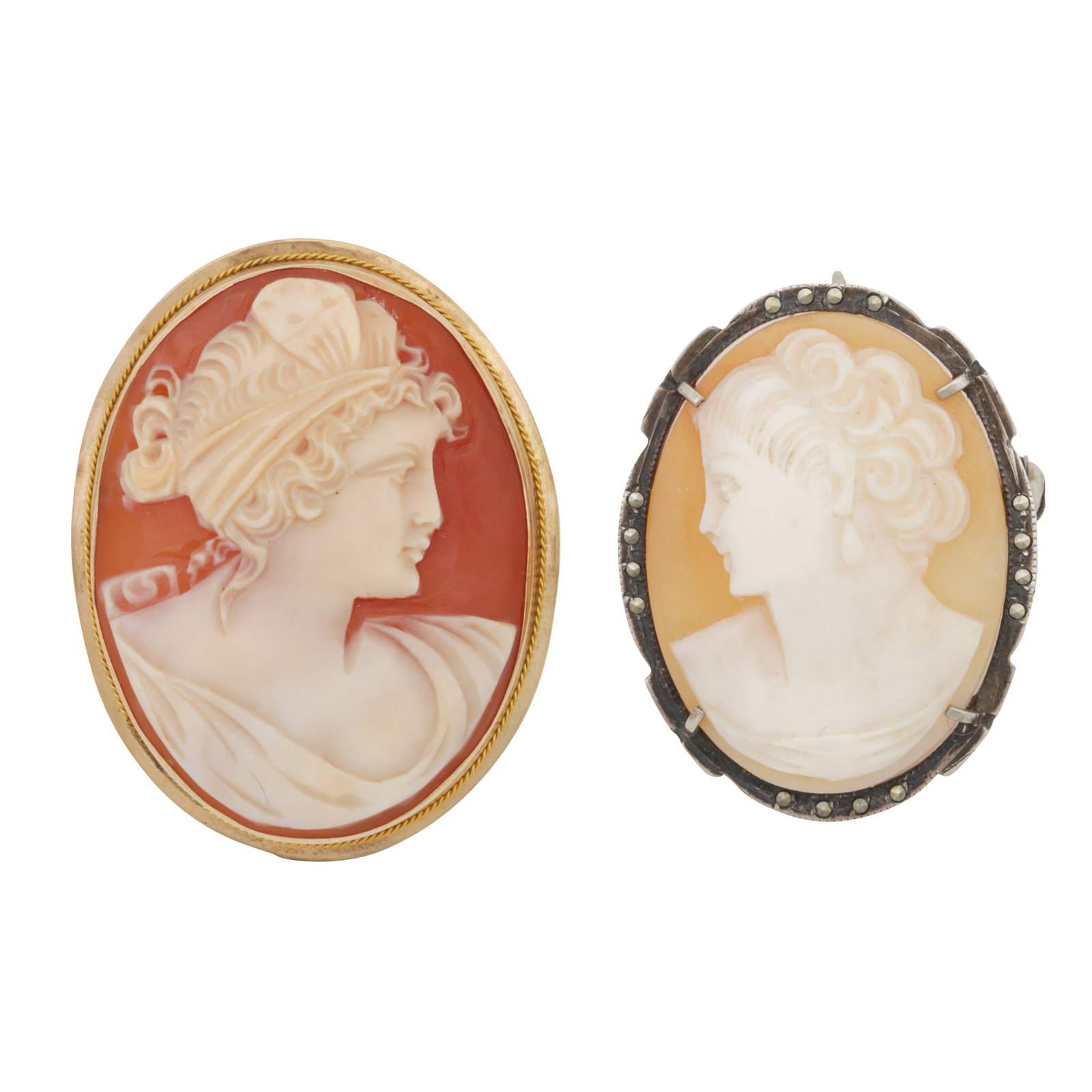 Two cameo brooches / pendants Yellow and white metal: Two cameo brooches / pendants Yellow and white metal Of oval shape, depicting a lady in profile, one set in yellow metal stamped 14k; the other set within white metal set with marcassites, stamped 800
