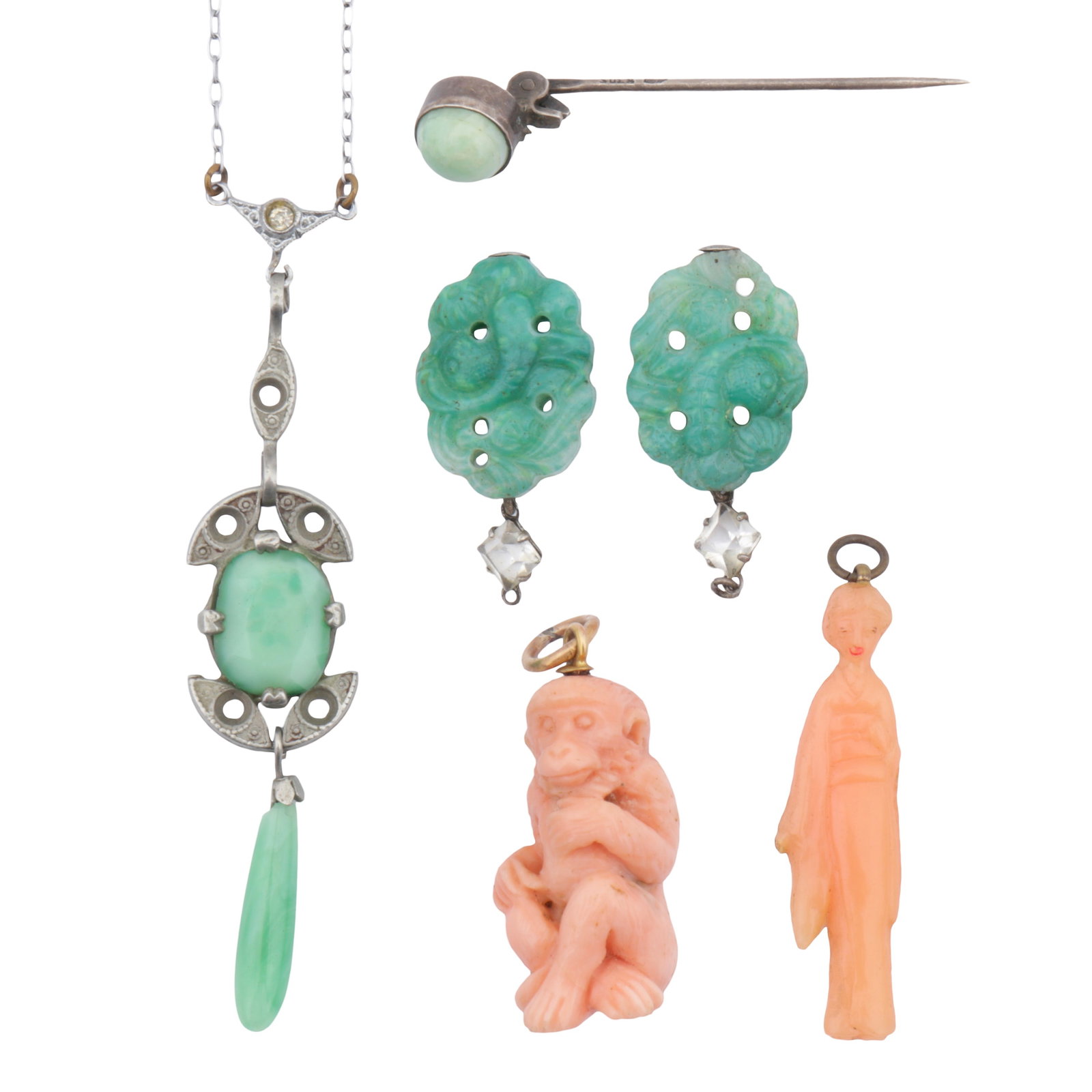 A group of jade and coral jewellery White and yellow metal: A group of jade and coral jewellery White and yellow metal Including a jade pendent necklace; two jade pendants; a jade pin; and two coral pendants; various sizes (6)