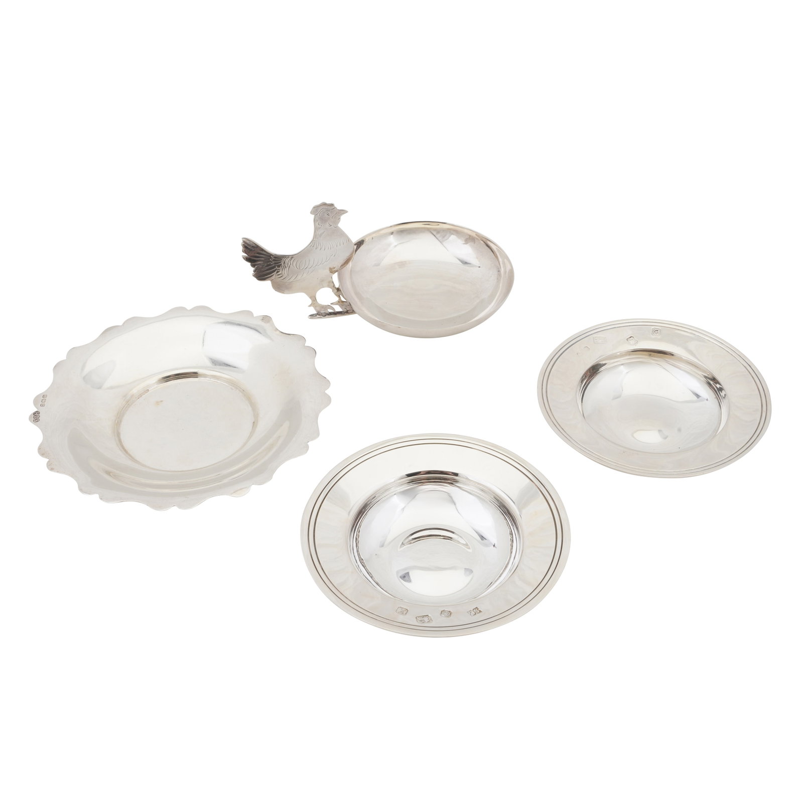 Chester 1912 by Sampson Mordan and Co Ltd A George V sterling silver pin din: Chester 1912 by Sampson Mordan and Co Ltd A George V sterling silver pin din The side handle as a hen. Together with three further dishes. (4) Weight – 175 grams / 5.63 ozt
