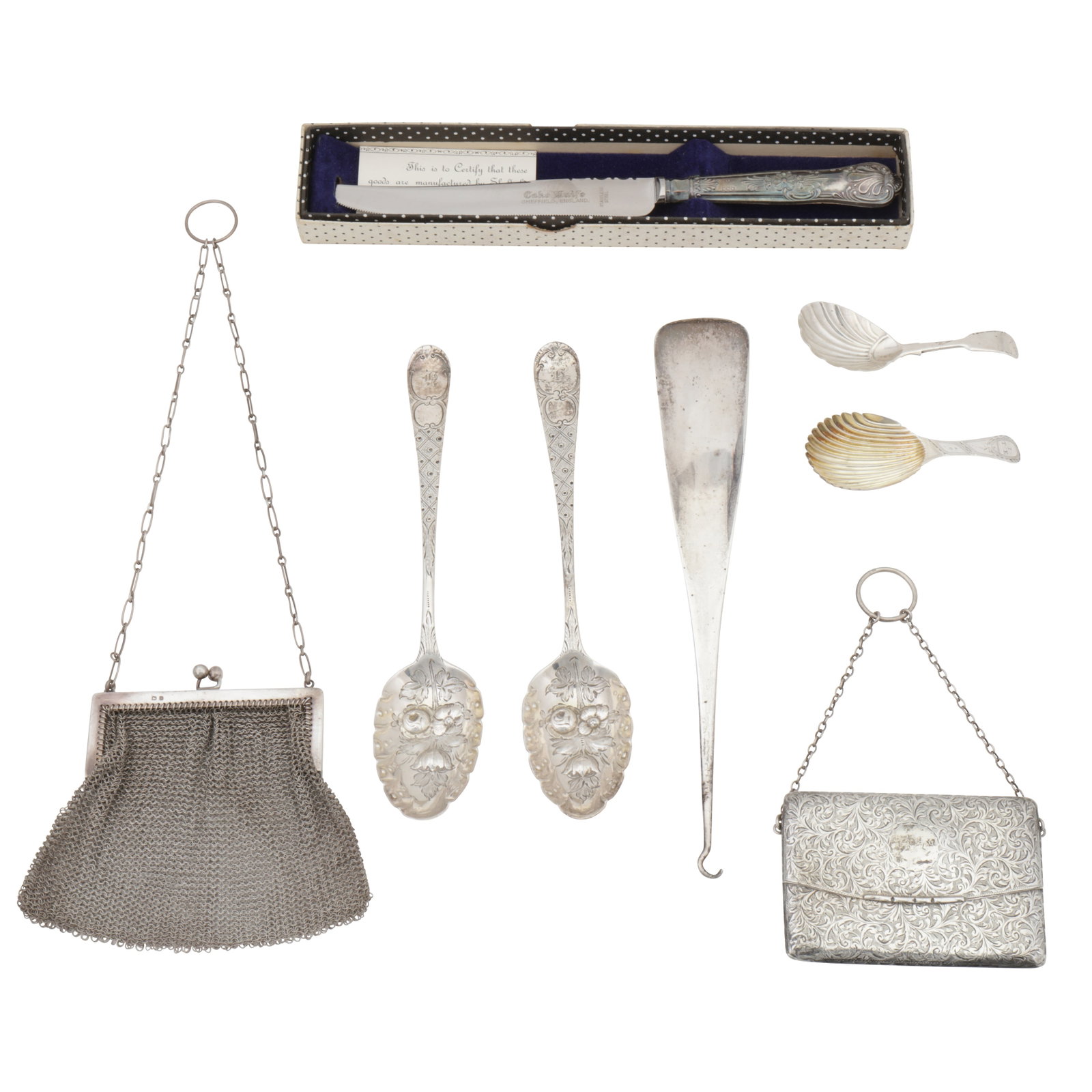 London 1792 by Peter and Ann Bateman A George III sterling silver caddy spoon: London 1792 by Peter and Ann Bateman A George III sterling silver caddy spoon Together with another, two tablespoons later decorated as berry spoon, a shoehorn, a mesh purse, a card case, and a boxed