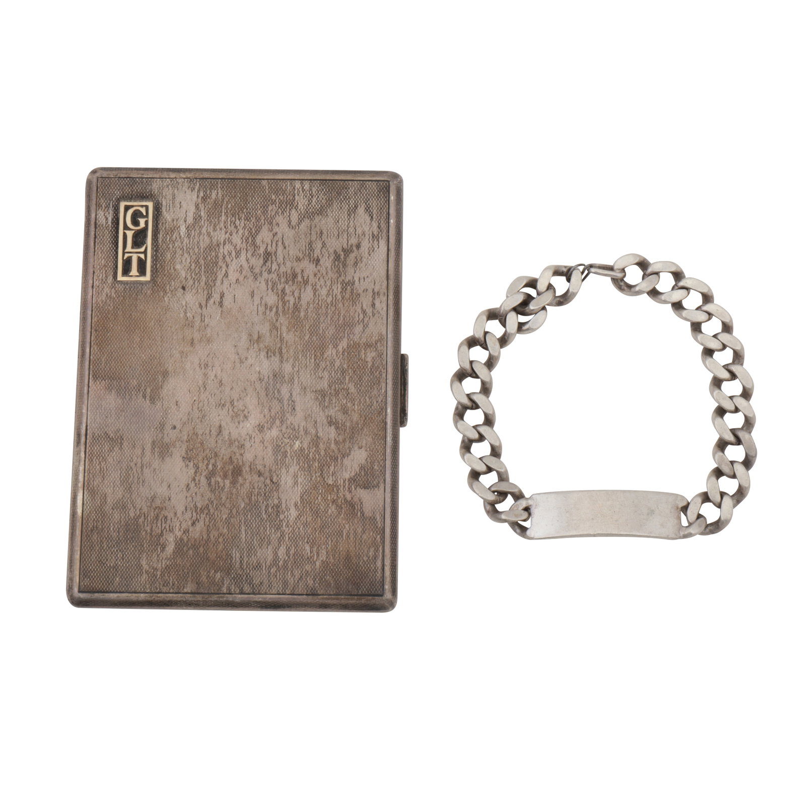 London 1934 by Cohen and Charles A George V sterling silver cigarette case: London 1934 by Cohen and Charles A George V sterling silver cigarette case Of rectangular form, with engine turned decoration to a push button release. The hinged lid with applied initials GLT. Togeth