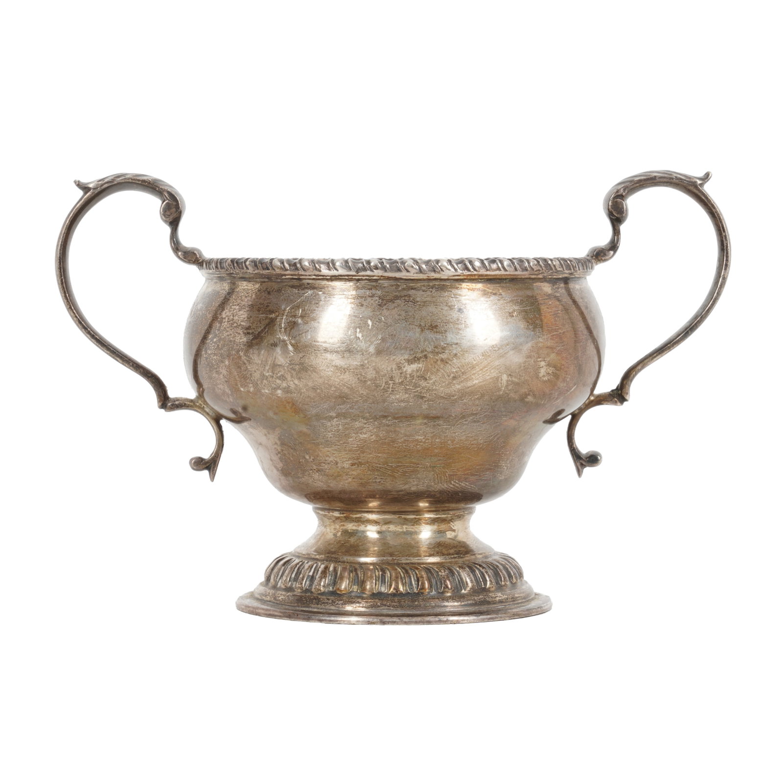 London 1975 by Bryan Savage An Elizabeth II sterling silver twin handled sugar bowl: London 1975 by Bryan Savage An Elizabeth II sterling silver twin handled sugar bowl Of circular form, with C scroll handles on a spreading circular foot and gadrooned rim. Length - 14.5 cm / 5.7