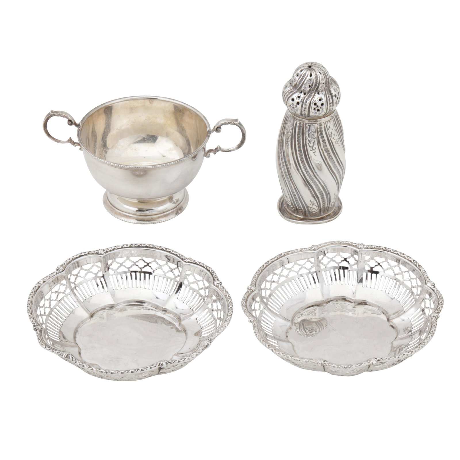 London 1888 by Horace Woodward and Co A Victorian sterling silver sugar caster: London 1888 by Horace Woodward and Co A Victorian sterling silver sugar caster Spirally fluted. Together with a pair of pierced bon bon dishes, and a twin handled bowl. (4) Weight -377 grams / 12.12