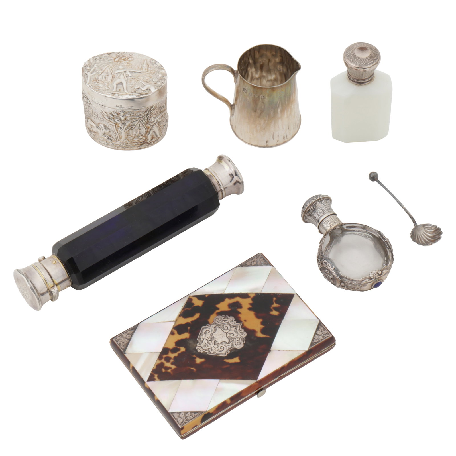 Birmingham 1908 by Hukin and Heath An Edwardian sterling silver cream jug: Birmingham 1908 by Hukin and Heath An Edwardian sterling silver cream jug Also to include a German embossed box with import marks, a double ended scent bottle, unmarked, engraved with name and 1864, t