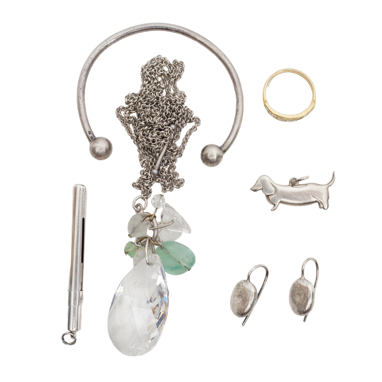 A group of miscellaneous White and yellow metal: A group of miscellaneous White and yellow metal To include a gem-set pendant chain necklace; stamped 925; a pair of textured oval silver earrings, UK hallmark; a dog pendant, stamped silver; a