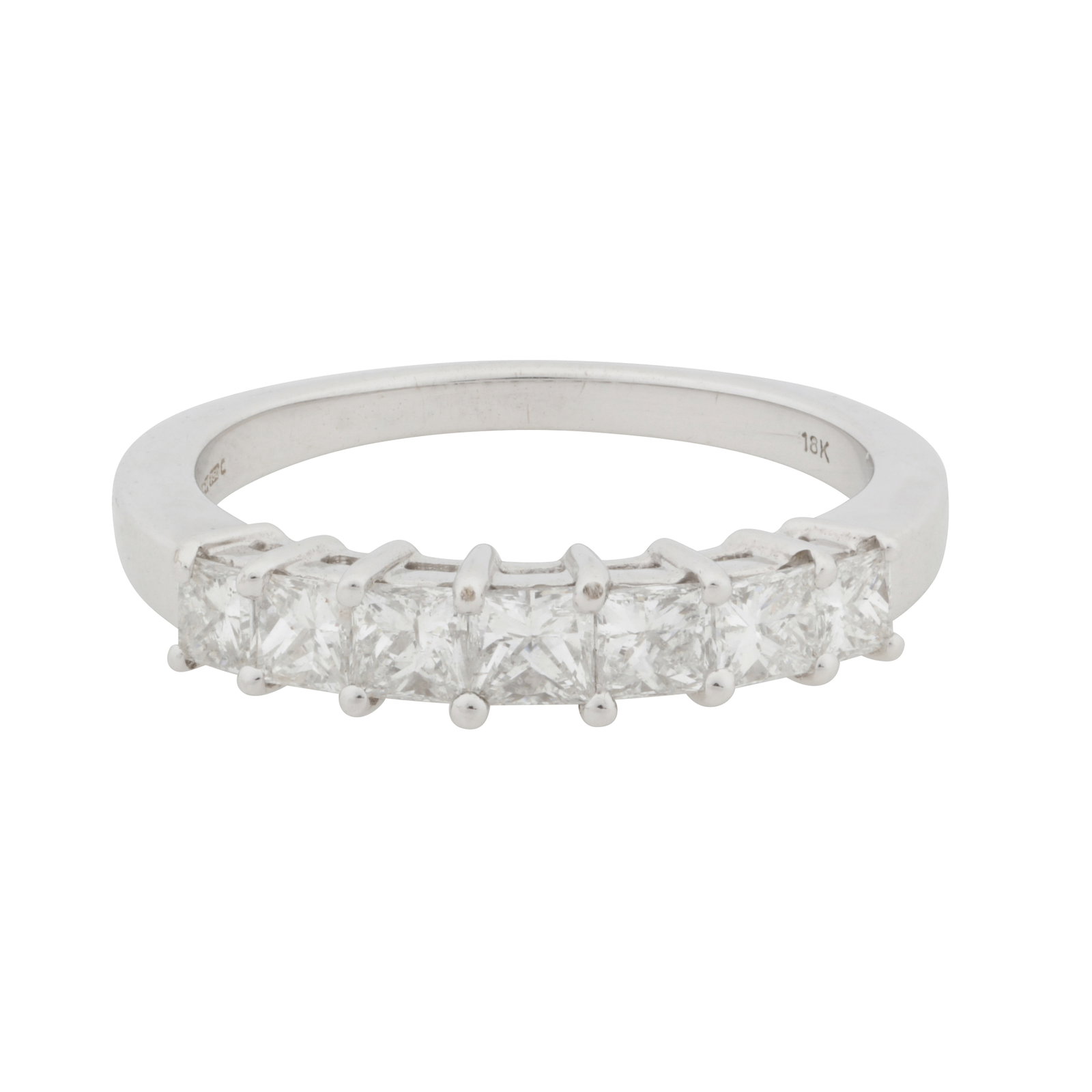 A seven-stone diamond ring 18kt white gold: A seven-stone diamond ring 18kt white gold Claw-set with graduating princess-cut diamonds, mounted in 18 carat white gold, diamonds approx.0.75 carat total, maker's mark, UK hallmark, stamped '18K',