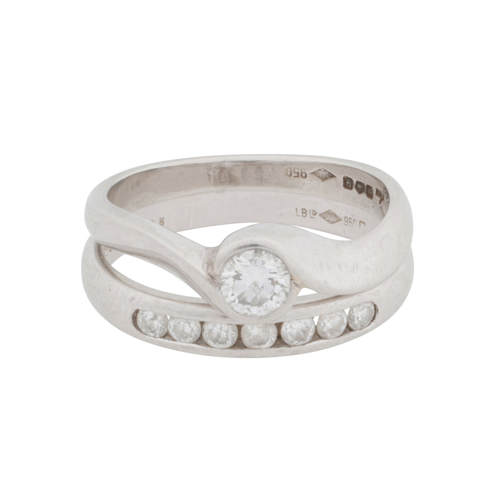 A diamond bridal ring set Platinum: A diamond bridal ring set Platinum Composed of two rings, one of crossover design, the other a seven stone band ring, set with brilliant-cut diamonds weighing approx. 0.35 carat total, maker's mark,