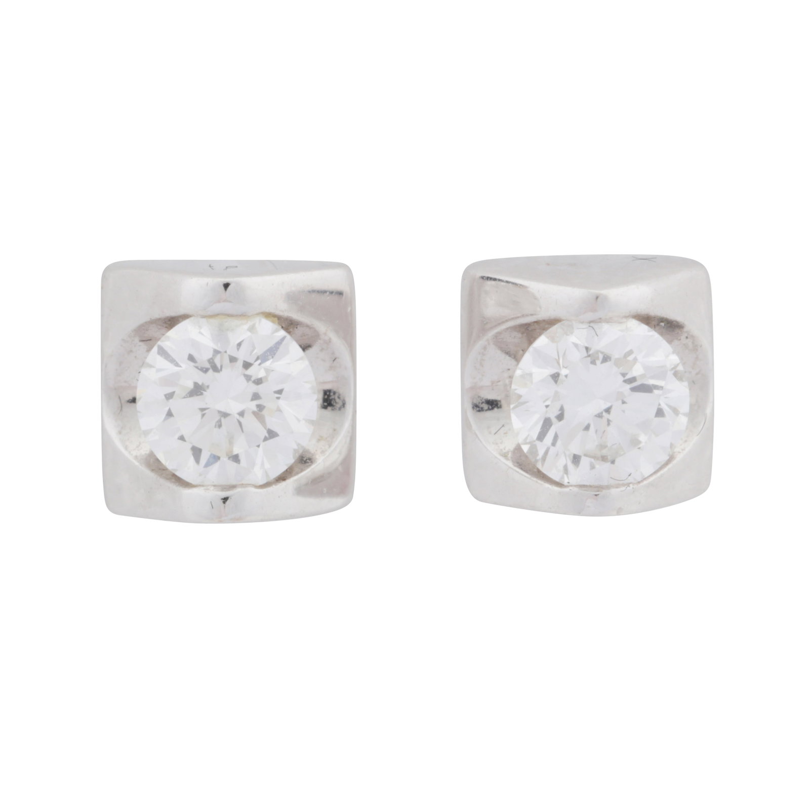 A pair of diamond stud earrings White metal: A pair of diamond stud earrings White metal Of pyramidal design, each set with a brilliant-cut diamond, post and butterfly fittings, diamonds approx. 0.48 carat total, maker's mark, stamped 750,