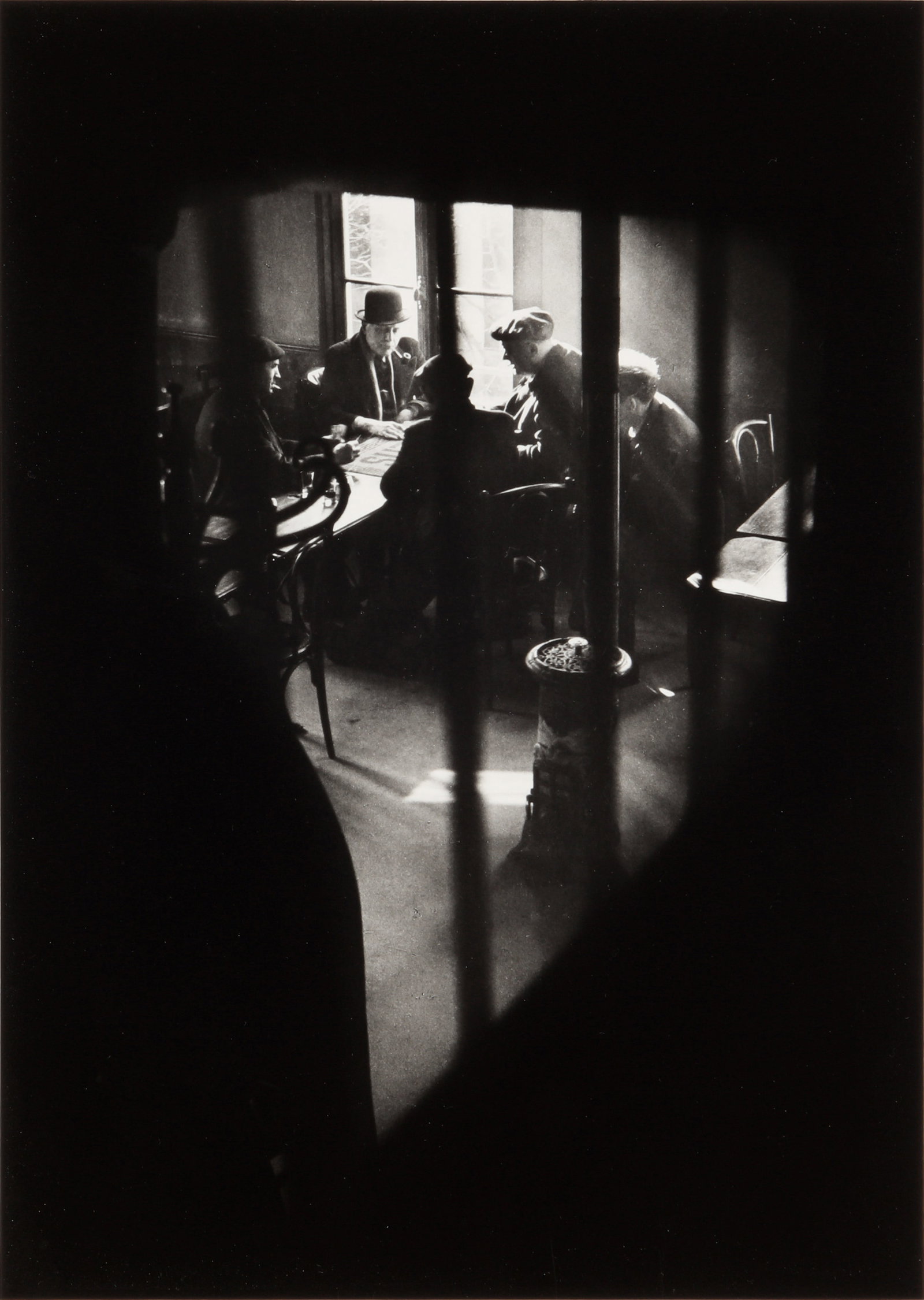 § Willy Ronis (1910-2009) Café Rue des Cascades, 1948: Silver gelatin print, printed later, mounted to card, image size, 31 x 22.1cm, sheet size, 39.5 x 29.7cm, signed and numbered '8' in lower margin by the photographer in pen.