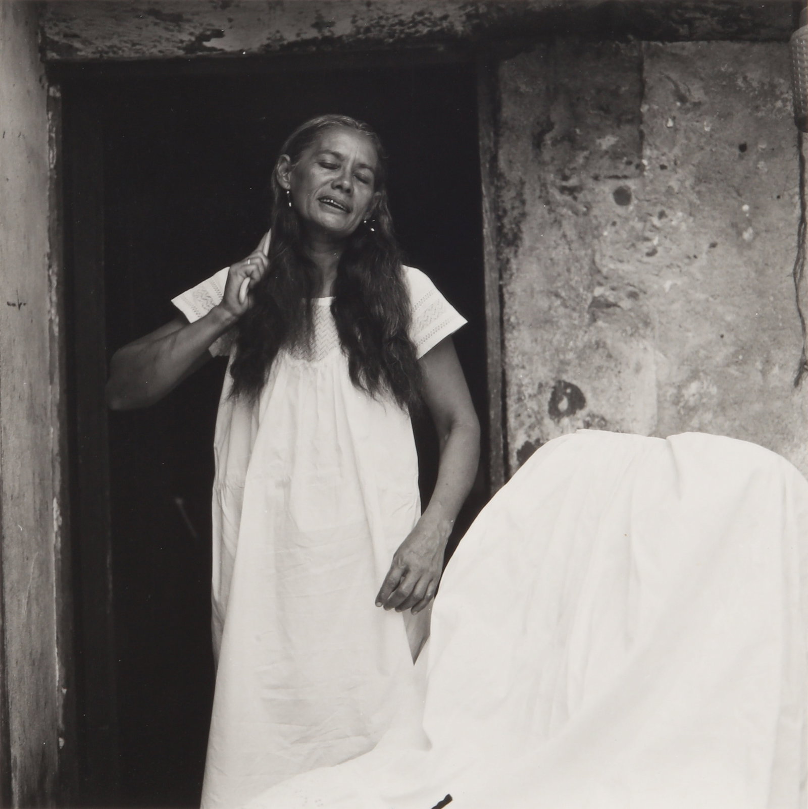 Mariana Yampolsky (1925-2002) Mujer de Tlacotalpan [Woman of Tlacotalpan] & La Ciega [The Blind: A pair of silver gelatin prints, printed 1980s, each image measuring 17 x 17cm, each sheet measuring 25.5 x 20.2cm, each signed by the photographer in pencil verso. Provenance:Acquired by the present 
