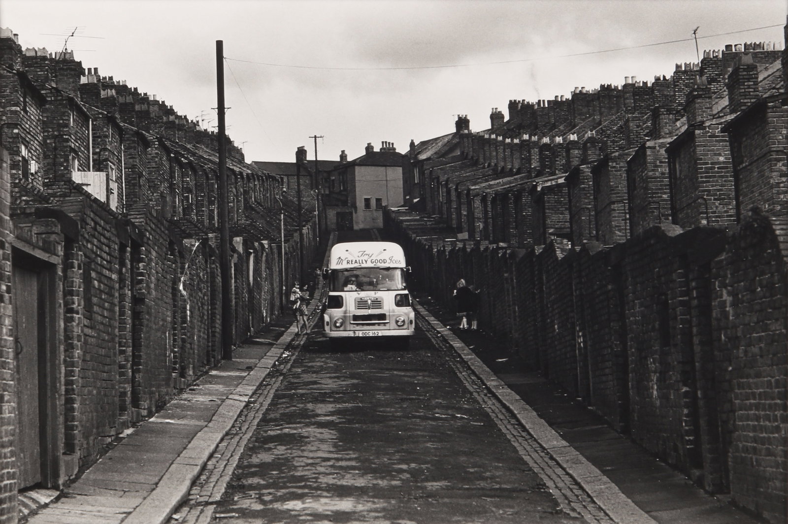 Nick Hedges (b.1943) Byker, Newcastle, 1975: Vintage silver gelatin print, image size 23 x 34cm, sheet size 24.5 x 36.5cm, signed, titled, and dated by the photographer in pencil verso, with Hedge's studio stamp verso. Framed, frame size 42 x 53