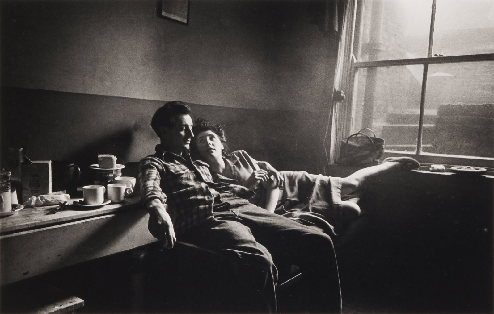 § Bert Hardy (1913-1995) Cockney Life at the Elephant and Castle, London, January 8, 1949: Silver gelatin print, printed later, image size 22.7 x 35.5cm, sheet size 30.5 x 40.5cm, signed by the photographer in ink lower margin recto, with Hardy's Chartlands Farm stamp verso. Cockney Life at