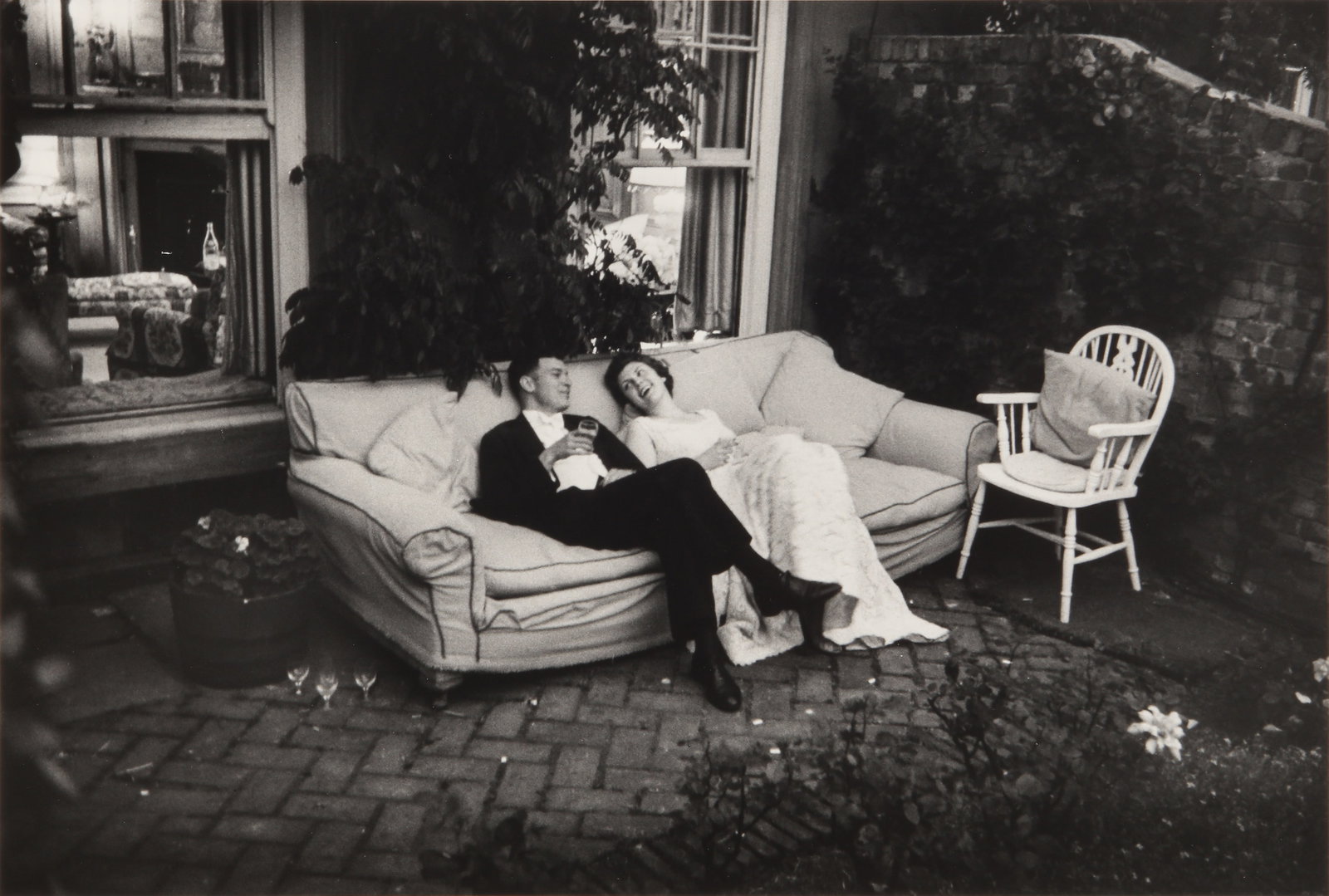 § Thurston Hopkins (1913-2014) The End of the Party, Highgate, London, 1955: Silver gelatin print, printed later, image size 24 x 35.3cm, sheet size 30.5 x 40.5cm, signed, titled, and dated by the photographer in pencil verso, with Hopkins' credit stamp verso. Provenance:Acqui