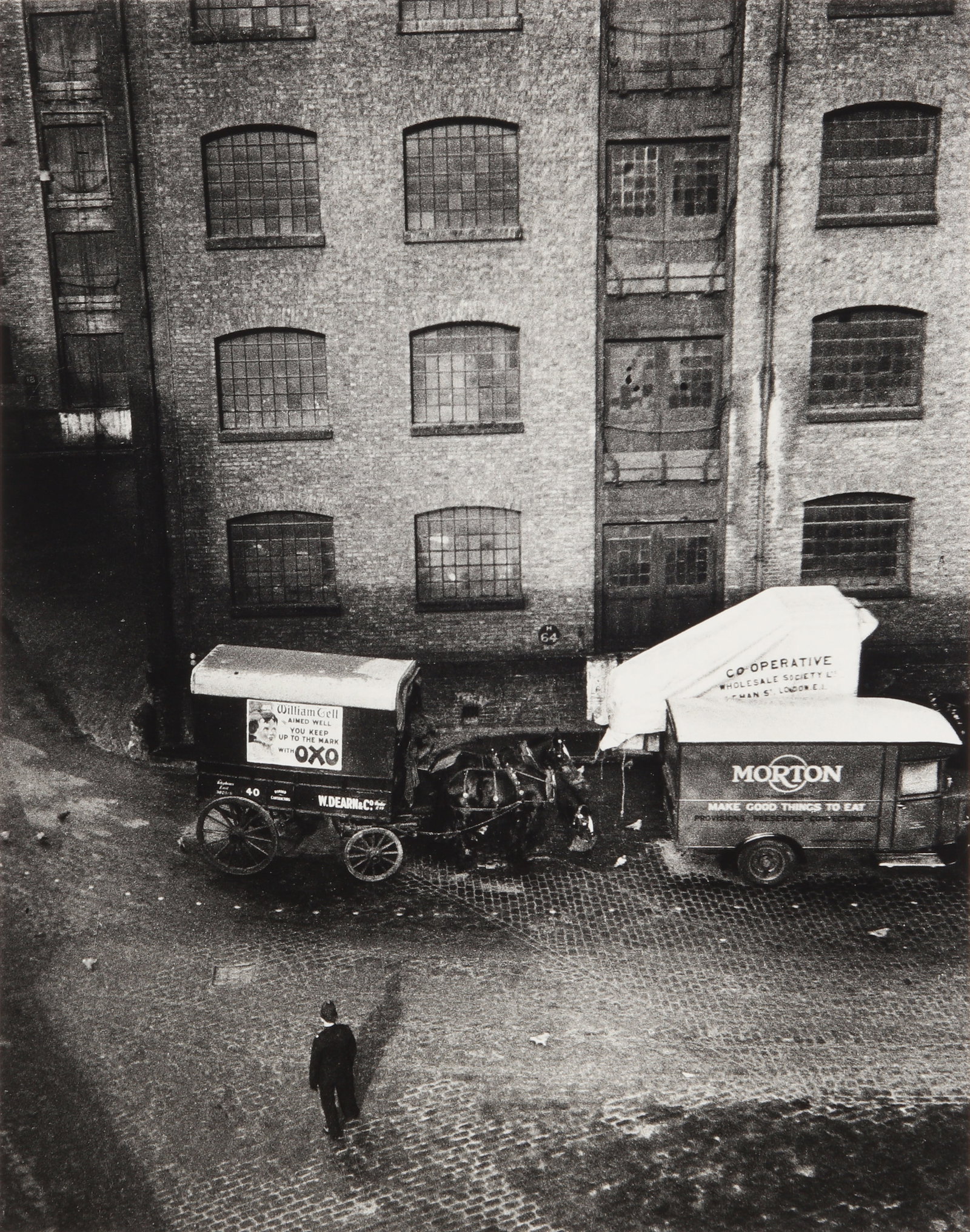 § Wolfgang Suschitzky (1912-2016) London Docks, 1934: Silver gelatin print, printed later, image size 37 x 29.3cm, sheet size 38.5 x 30.5cm, signed, titled, dated and numbered by the photographer in black crayon verso. Framed, frame size 51.5 x 41.5cm. P