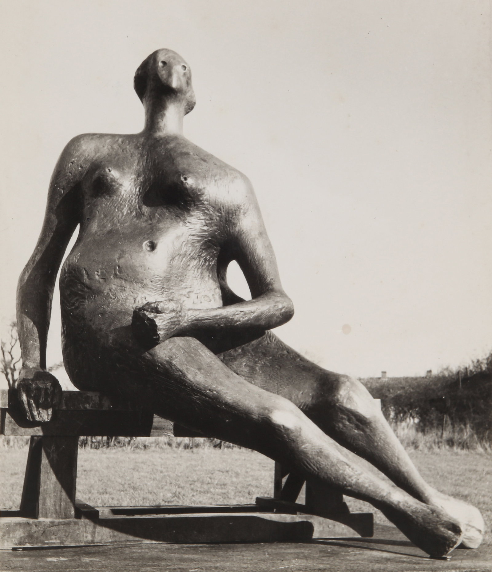 Henry Moore (1898-1986) Seated Woman, 1957: Vintage silver gelatin print, image size 23 x 19.7cm, sheet size 25 x 20.3cm, with Henry Moore's Hoglands stamp and hand-annotated title/date/size/material stamp verso.