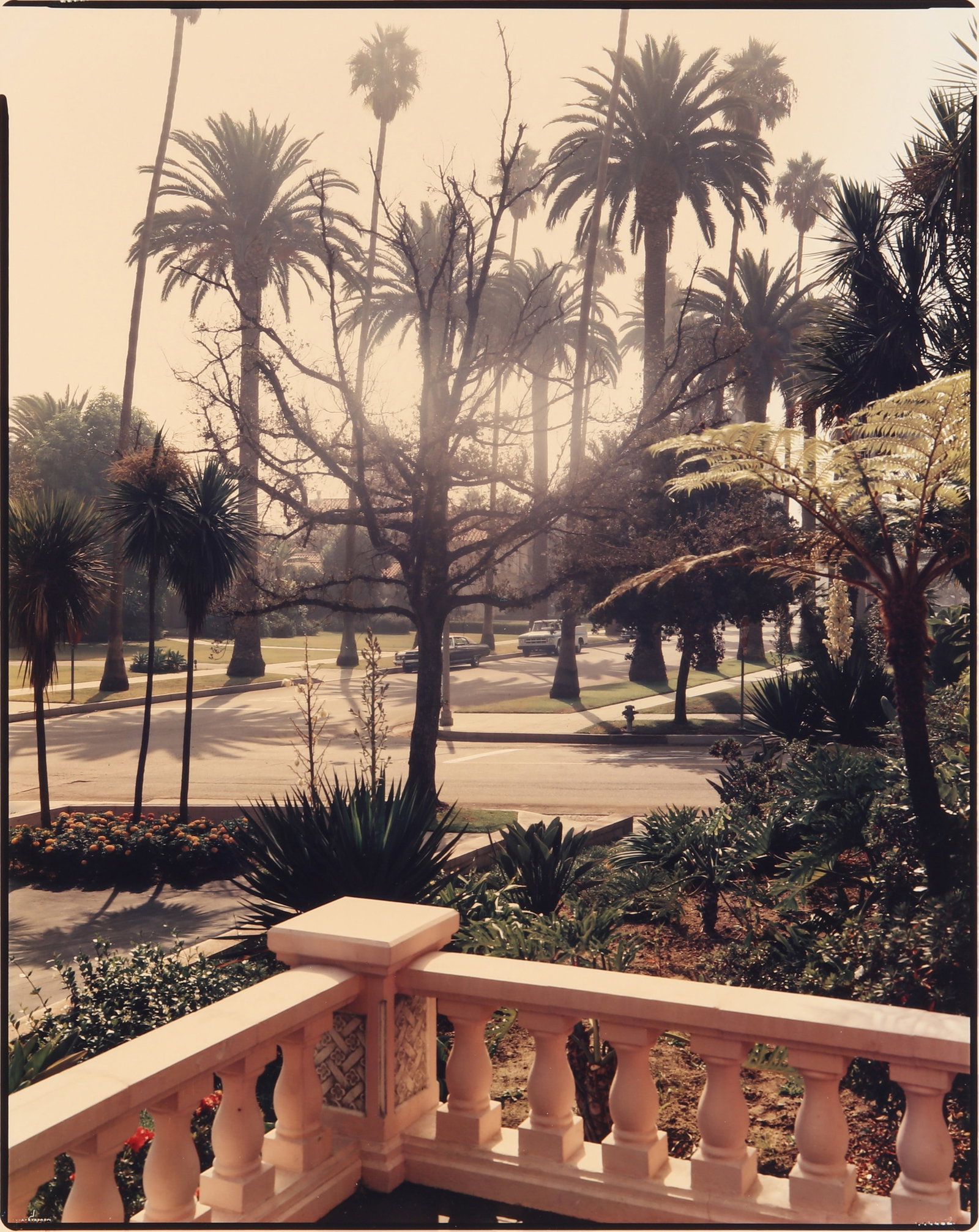 Stephen Shore (b.1947) Foothill Road, Beverly Hills, California, September 10, 1974: Chromogenic print, printed later, image size 45 x 36cm, sheet size 50.5 x 41cm, signed, titled, and dated by the photographer in black ink verso. Framed, frame size 73 x 62cm. Provenance:Phillips de P