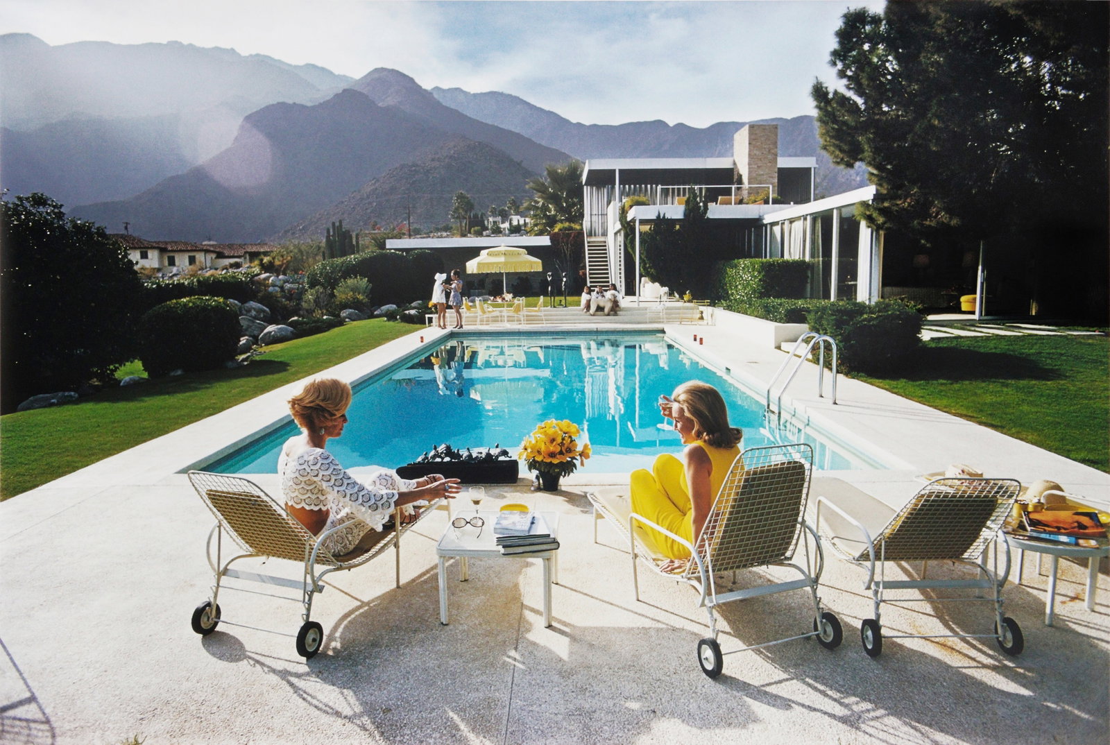 Slim Aarons (1916-2006) Poolside Pairs, 1970: Chromogenic print, printed later, image size 96 x 142cm, sheet size 101 x 153cm, signature blindstamp and numbered 108/150 in an unidentified hand in ink in the margin, accompanied by a Getty Images G