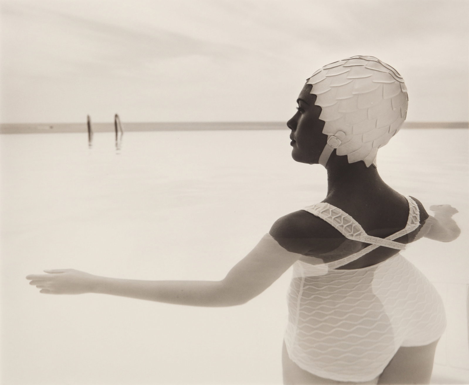 § Nadav Kander (b.1961) Swimmer, Cannes, France, 1993: Silver gelatin print, printed later, image size 33 x 40cm, sheet size 40.5 x 50.5cm, signed and editioned 9/25 by the photographer in pencil lower margin recto, additionally signed and annotated by th