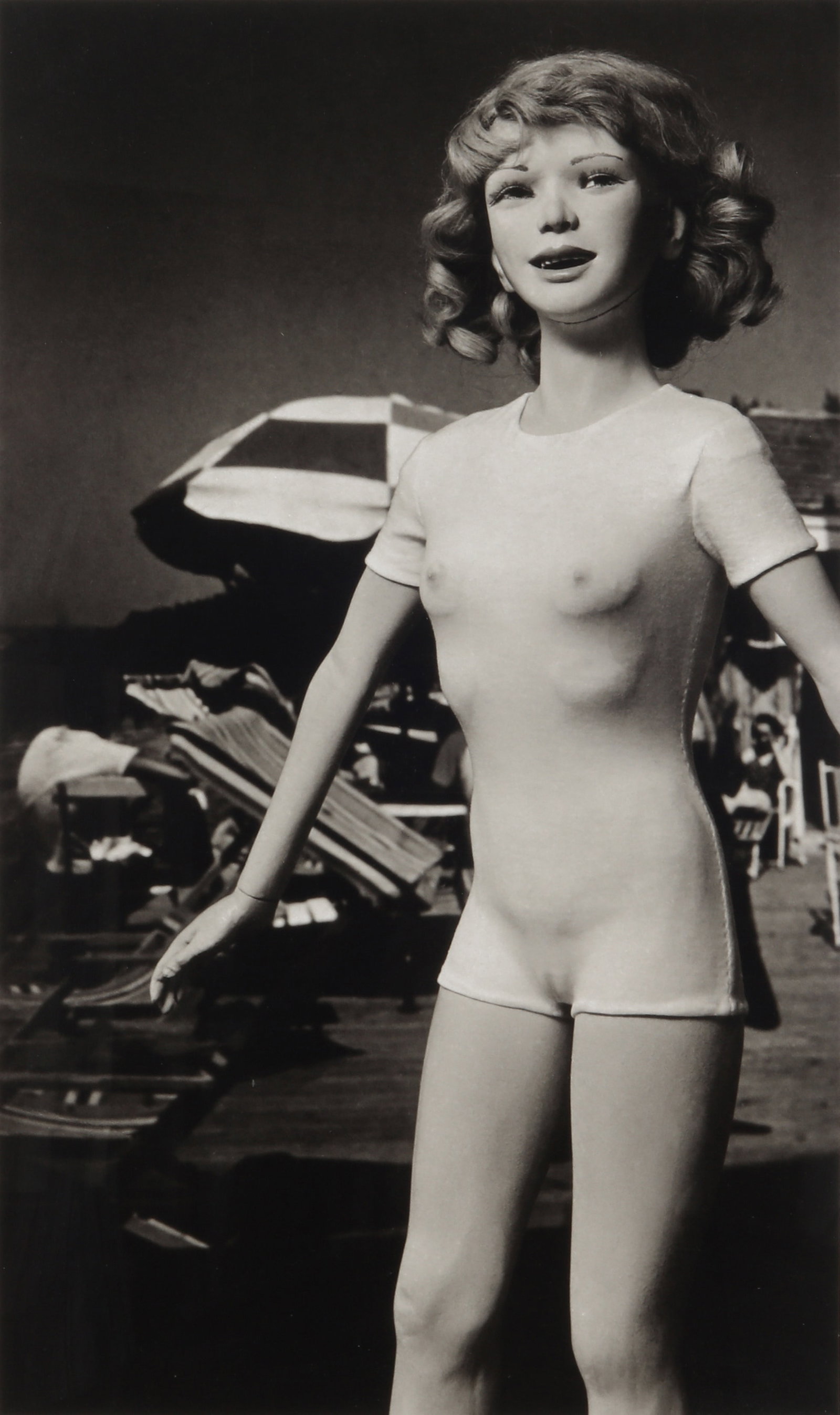 Morton Bartlett (1909-1992) Untitled (Girl at the Beach): Archival pigment print, printed 2010 from the original 1950 negative, image size 55 x 33cm, edition 2/10. Framed, frame size 77 x 52.5, with Morton Bartlett Original Collection label affixed verso. Pr