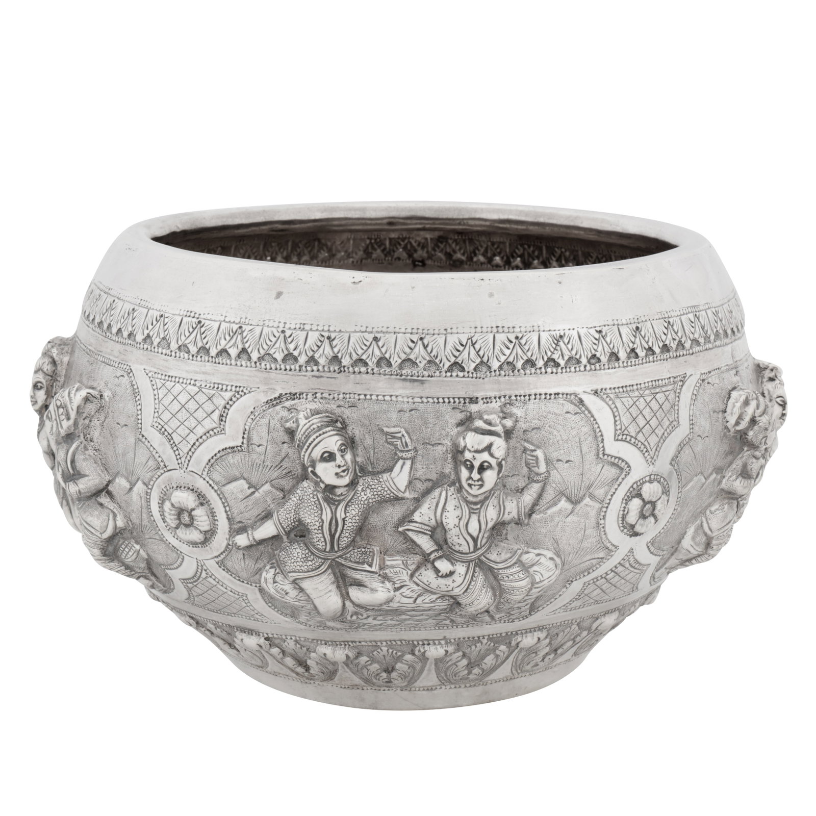 Lucknow circa 1910 An early 20th century Anglo – Indian unmarked silver bowl: Lucknow circa 1910 An early 20th century Anglo – Indian unmarked silver bowl Raj period. Of compressed circular form with a fold over rim. The body with embossed figural panels each of two figures i