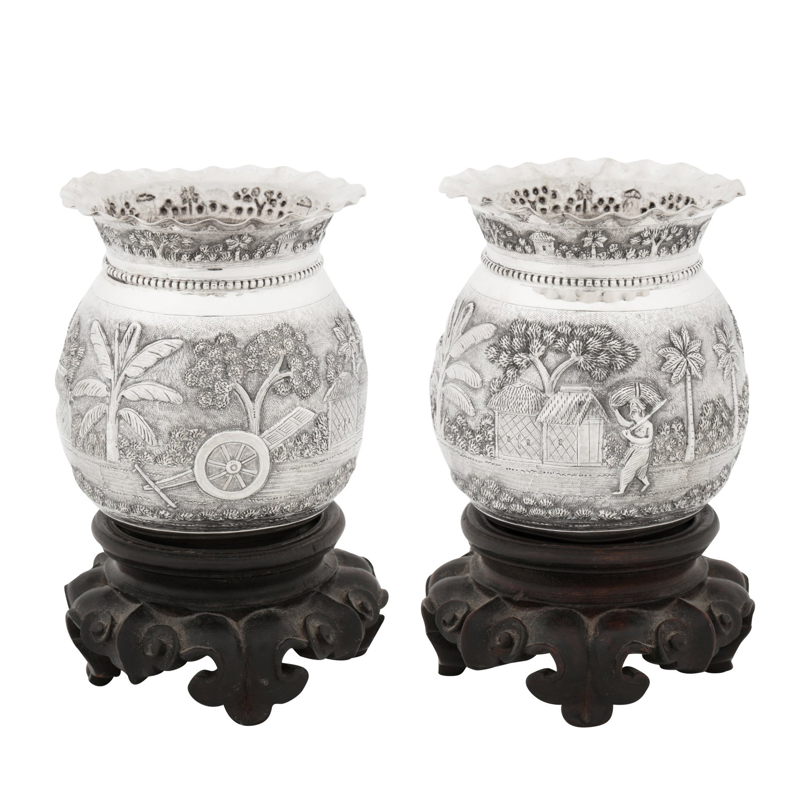 Bhowanipore, Calcutta circa 1920 by Dass and Dutt A pair of early 20th century Anglo-Indian silver: Bhowanipore, Calcutta circa 1920 by Dass and Dutt A pair of early 20th century Anglo-Indian silver vases Raj period. Of rounded circular form with everted scalloped crimped rims. Each with chased deco