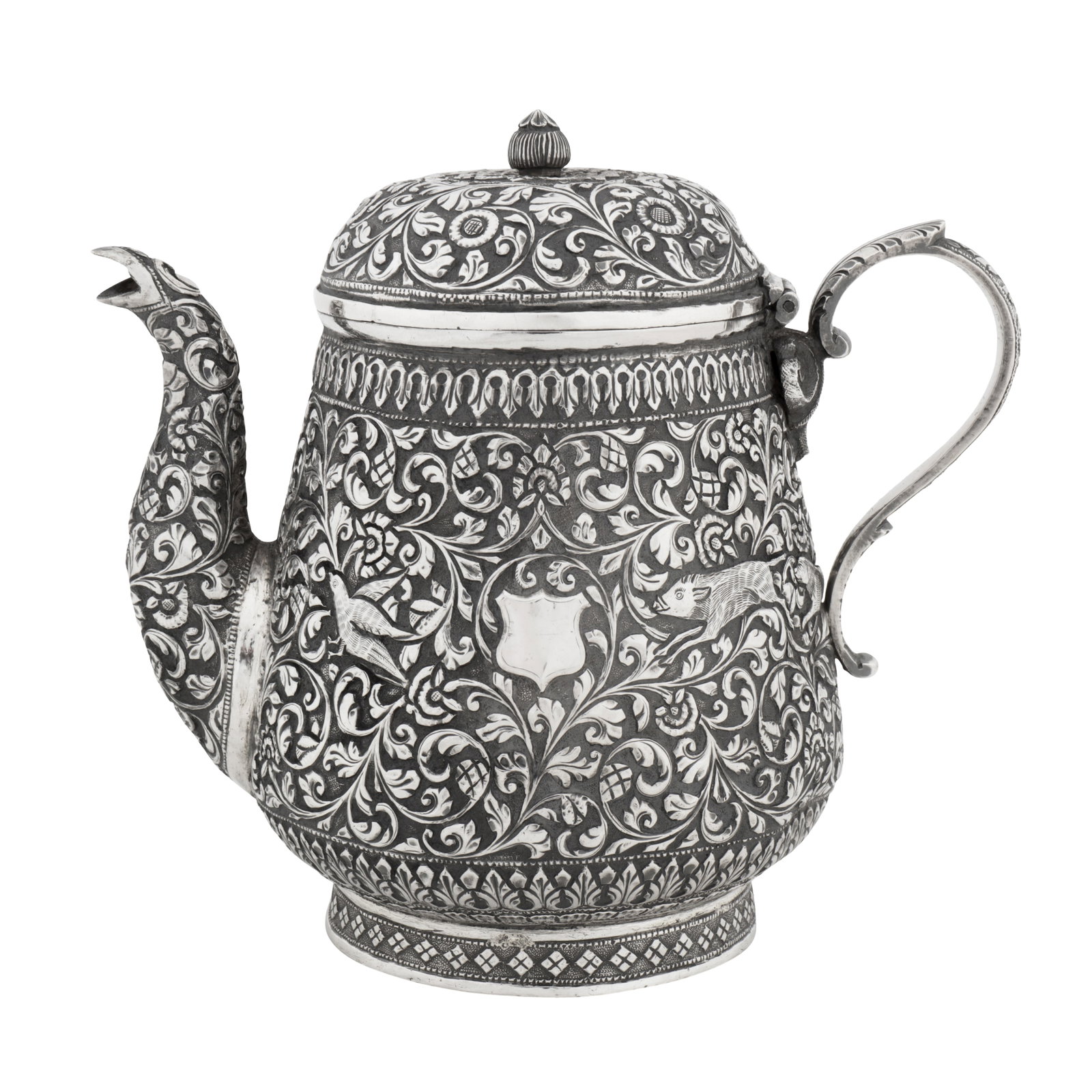 Cutch circa 1900, marked DJ (unidentified) A late 19th / early 20th century Anglo-Indian silver: Cutch circa 1900, marked DJ (unidentified) A late 19th / early 20th century Anglo-Indian silver teapot Raj period. Of rounded tapering baluster from upon a collet foot, a curved spout opposite a leaf 