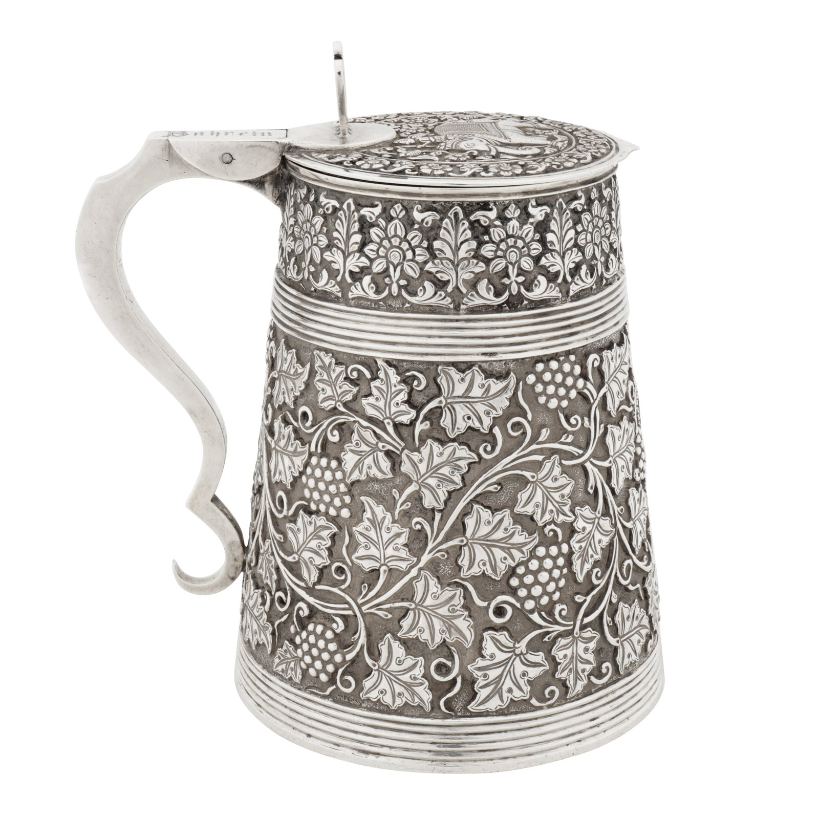 Madras circa 1820 An early 19th century Indian colonial silver tankard: Madras circa 1820 An early 19th century Indian colonial silver tankard Of tapering cylindrical form with shaped scroll handled leading to a disc lid with shaped apron raised by a chair form open work 