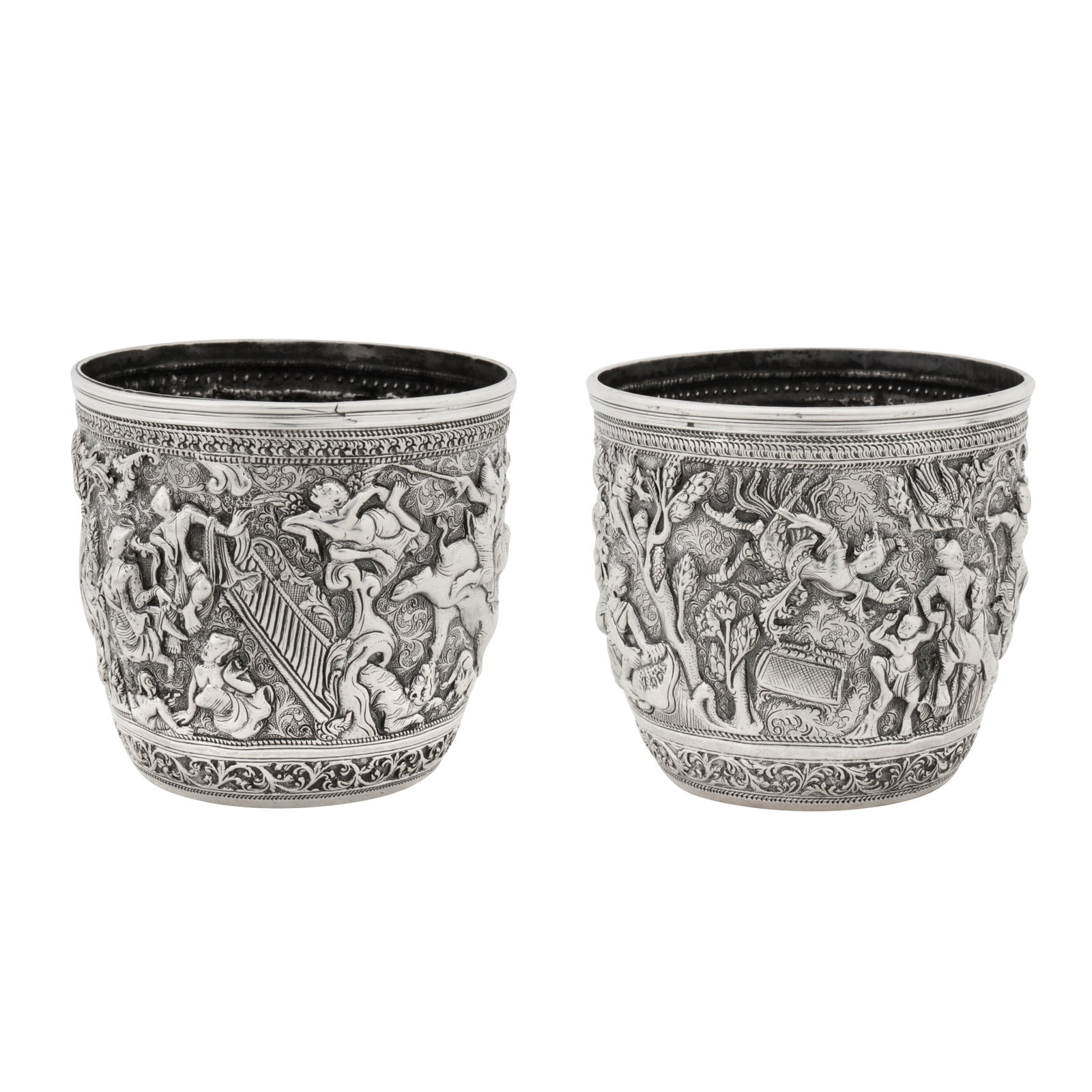 Mandalay circa 1880 A pair of late 19th century Burmese unmarked silver bowls: Mandalay circa 1880 A pair of late 19th century Burmese unmarked silver bowls Each of rounded cylindrical form with moulded rims, embossed and chased decoration of figural scenes including Kinnaris al
