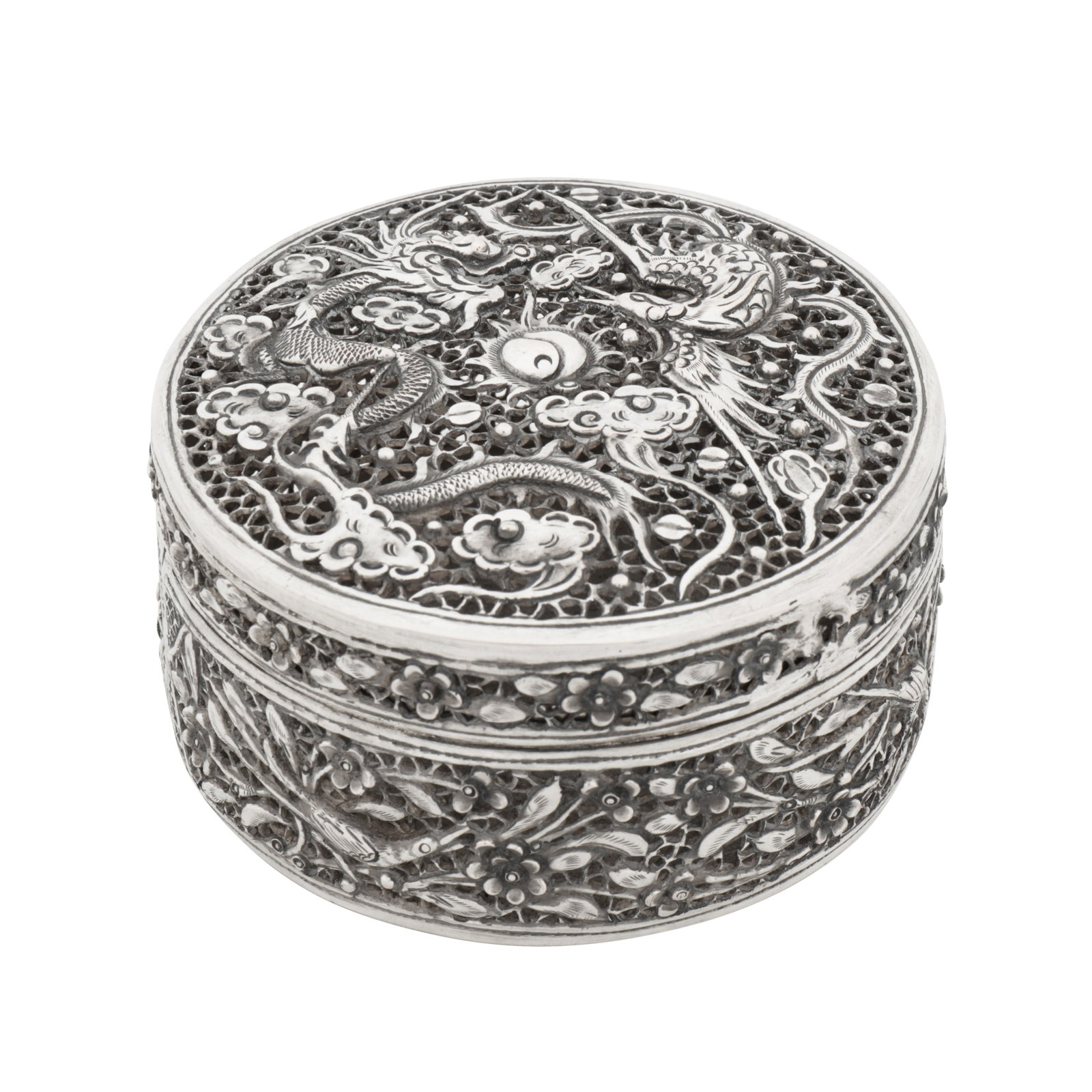 Hu? circa 1930, marked Da Fu An early 20th century Vietnamese silver box: Hu? circa 1930, marked Da Fu An early 20th century Vietnamese silver box Of cylindrical form with a gently domed hinged lid. The lid with embossed and pierced decoration of a Chinese dragon amidst clo