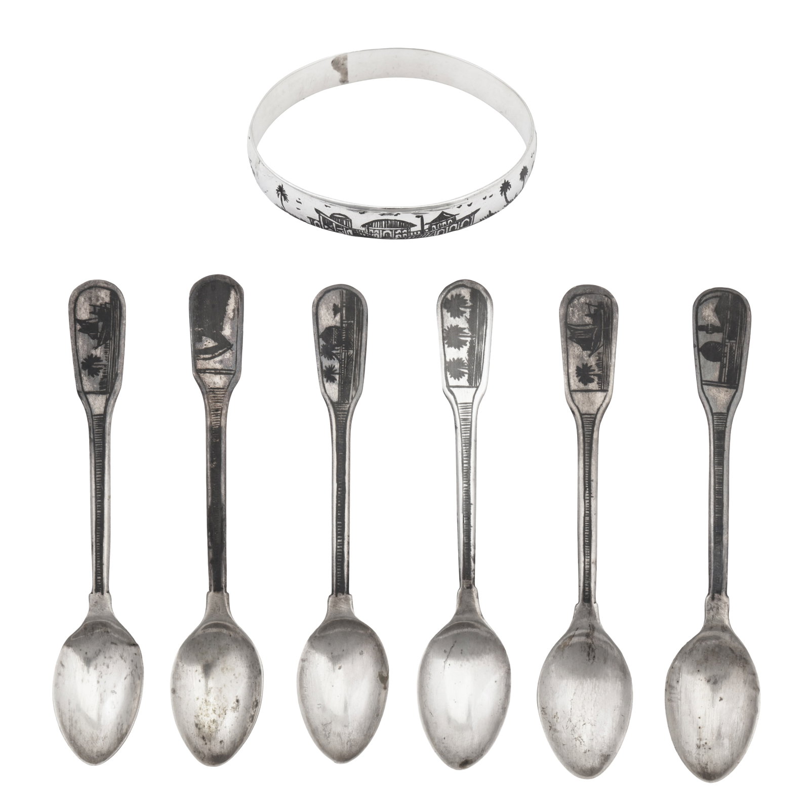 Omara circa 1925 A set of six early 20th century Iraqi silver and niello coffee spoons: Omara circa 1925 A set of six early 20th century Iraqi silver and niello coffee spoons Fiddle pattern, each with different scenes including dhow sailing boats and the Tomb of Ezra. Together with a ban