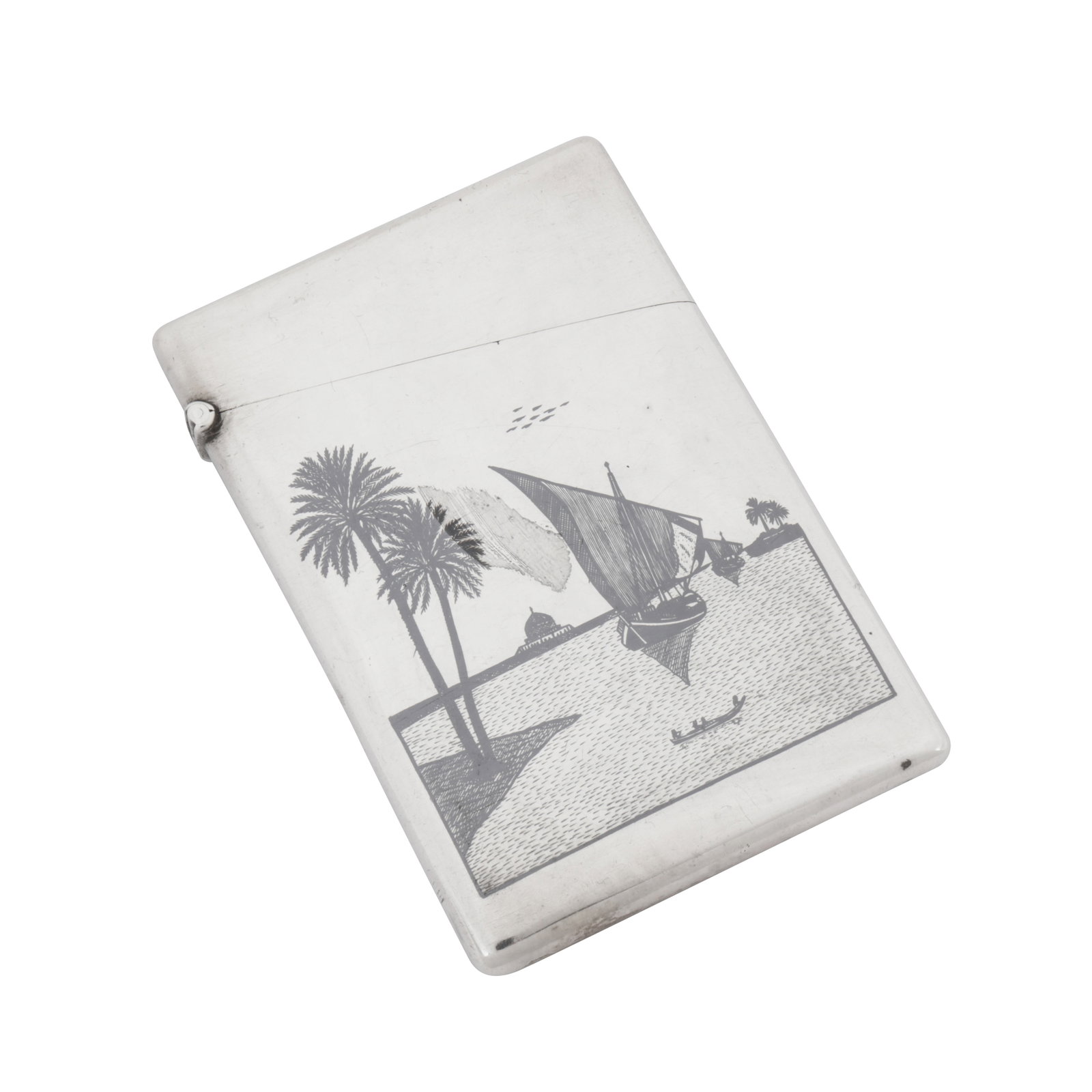 Omara circa 1920, signed Baqqal and Abbas An early 20th century Iraqi silver and niello card case: Omara circa 1920, signed Baqqal and Abbas An early 20th century Iraqi silver and niello card case Of rectangular form with a hinged lid, the front with a finely nielloed scene of dhow sailing boats on