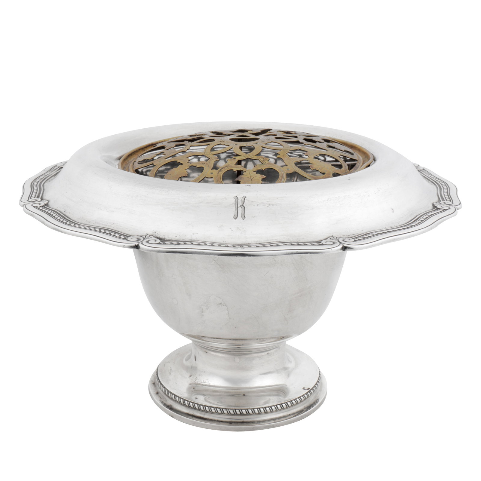 New York circa 1920 by Tiffany and Co An early 20th century American sterling silver centrepiece or: New York circa 1920 by Tiffany and Co An early 20th century American sterling silver centrepiece or wine cooler Of shaped rounded formed with a circular pedestal base, gadrooned and scroll edge. Fitte