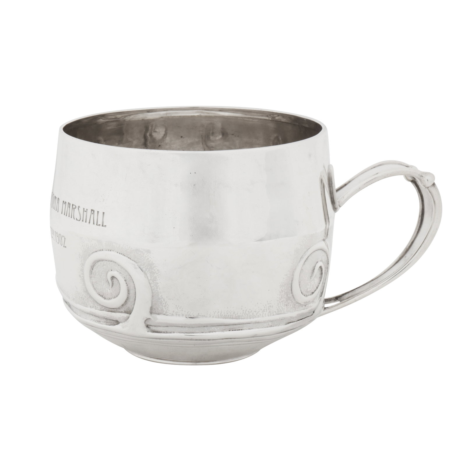 Birmingham 1900 by Liberty and Co A Victorian ‘Arts and Crafts’ sterling silver mug: Birmingham 1900 by Liberty and Co A Victorian ‘Arts and Crafts’ sterling silver mug Of broadly cylindrical form with strap handle with applied edges, the body with repoussé scrolls. The front eng