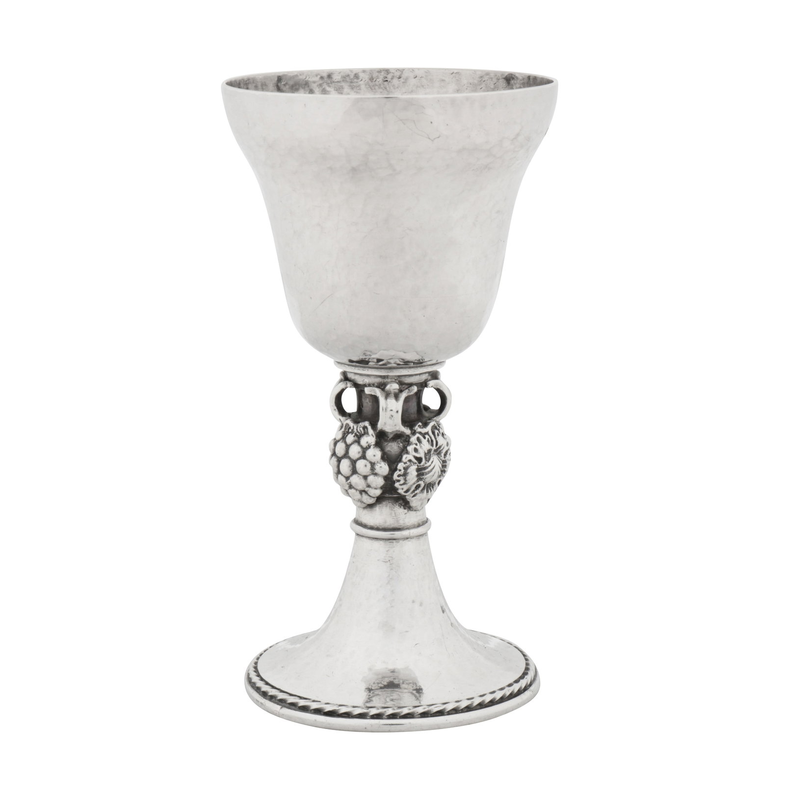 London 1936 by Omar Ramsden (1873-1939) An Edward VIII Arts and Crafts sterling silver wine goblet: London 1936 by Omar Ramsden (1873-1939) An Edward VIII Arts and Crafts sterling silver wine goblet A bell form bowl with a caulked rim upon a trumpet foot with cast and applied bosses of grapes and le