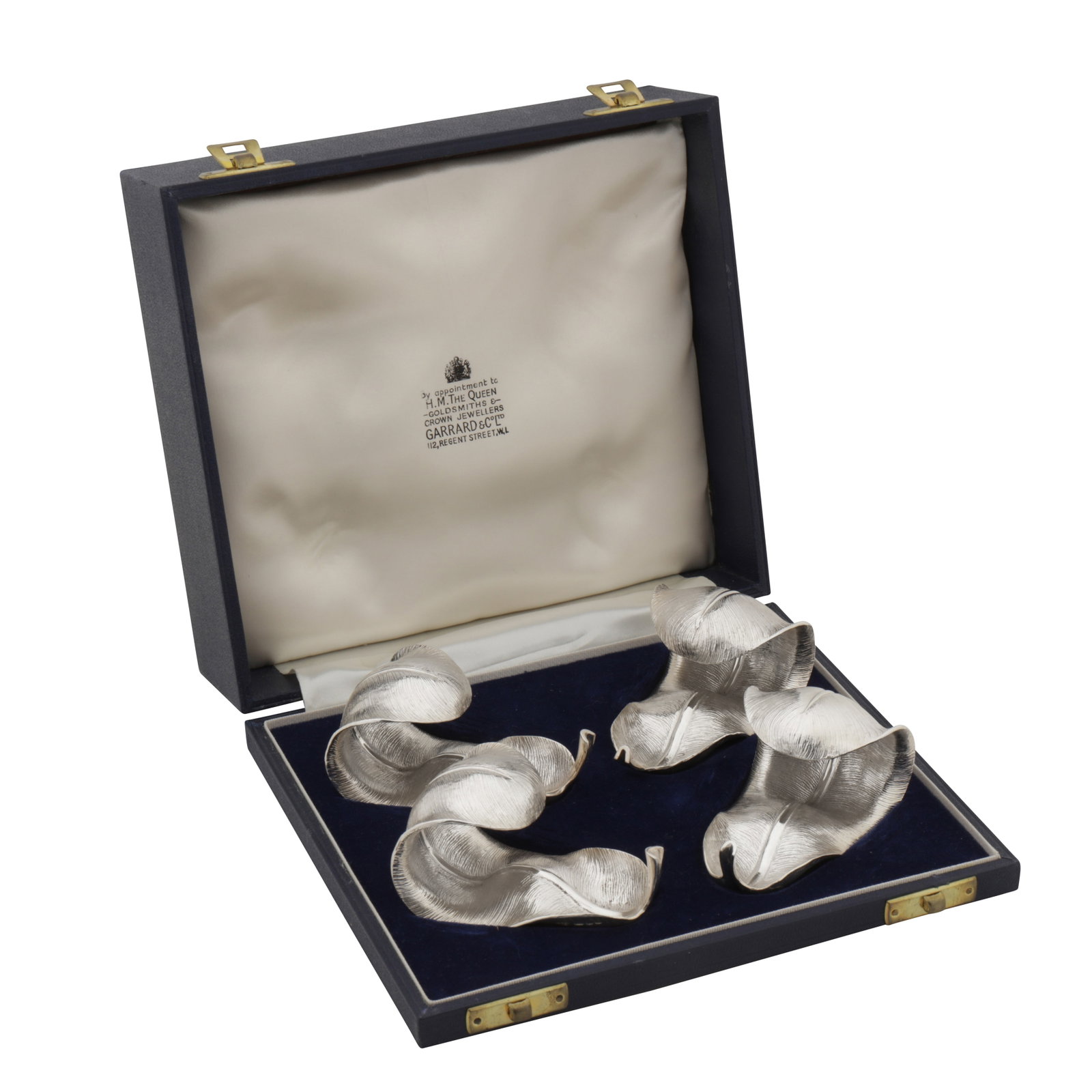 London 1968/69 by Garrard and Co A cased set of four Elizabeth II sterling silver napkin rings (1 of 5)