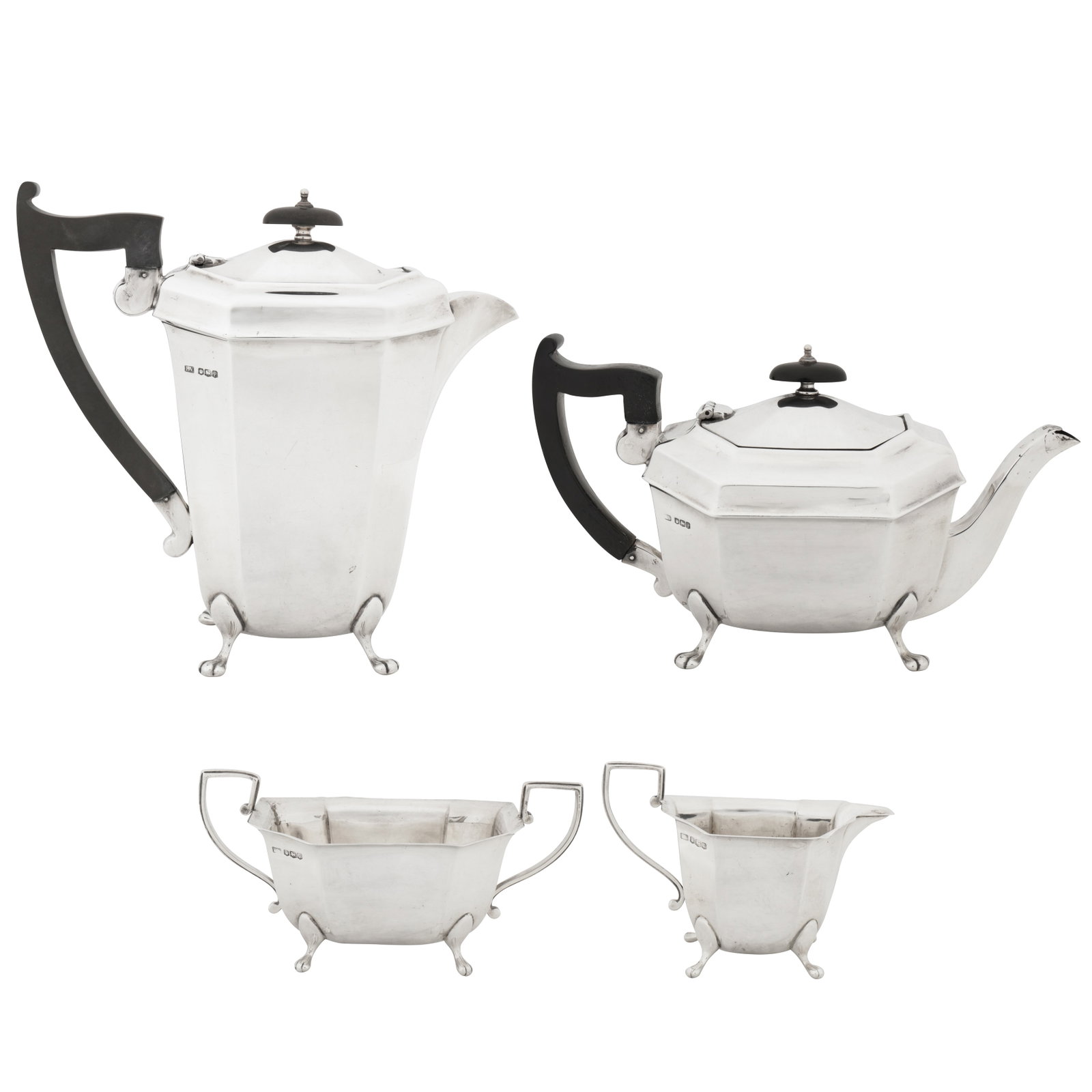 Sheffield 1932 by Emile Viner A George V sterling silver four-piece tea and coffee service: Sheffield 1932 by Emile Viner A George V sterling silver four-piece tea and coffee service Comprising a hot water / coffee pot, a teapot, a milk jug, and a twin handled sugar bowl. Each of rectangular