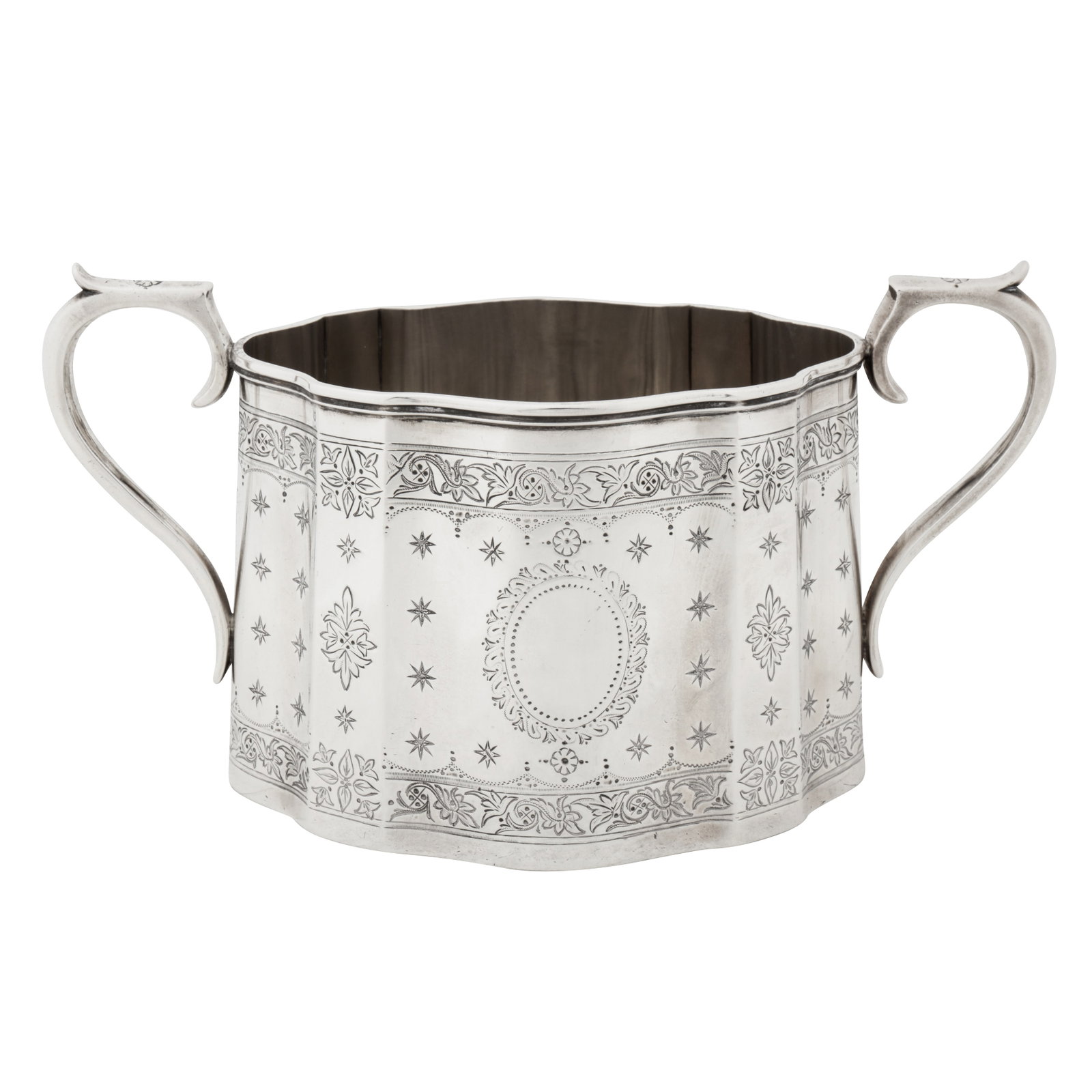 London 1872 by Robert Harper A Victorian sterling silver twin handled sugar bowl: London 1872 by Robert Harper A Victorian sterling silver twin handled sugar bowl Of tapering shaped oval form with C scroll handles. Engraved decoration of foliate bands, mullets (stars) and vacant ov
