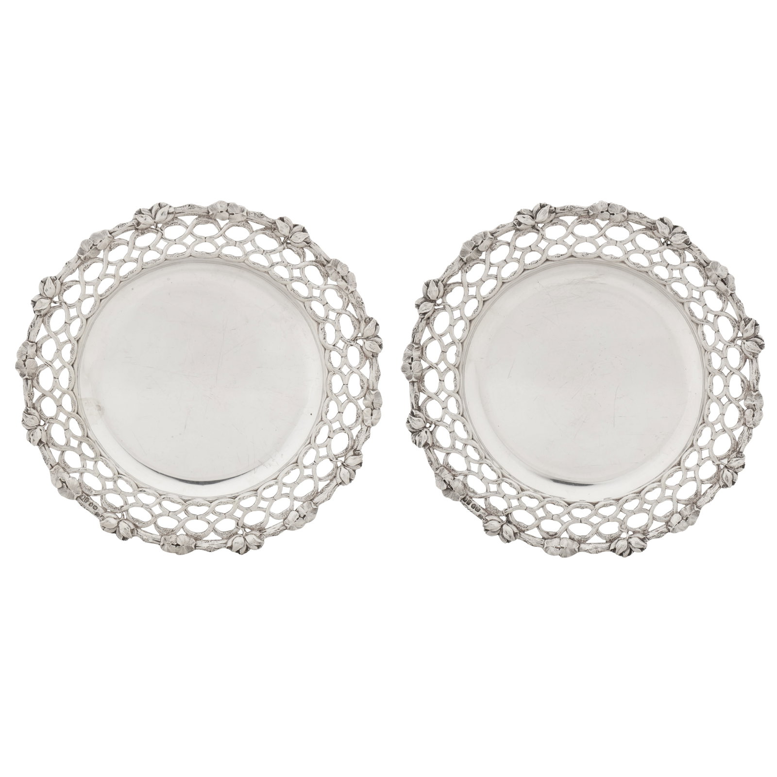 London 1856 by Charles Thomas Fox and George Fox A pair of Victorian sterling silver dessert dishes: London 1856 by Charles Thomas Fox and George Fox A pair of Victorian sterling silver dessert dishes Each of broadly circular form with a pierced cast broad edge of interlaced tendrils to a rim of lily