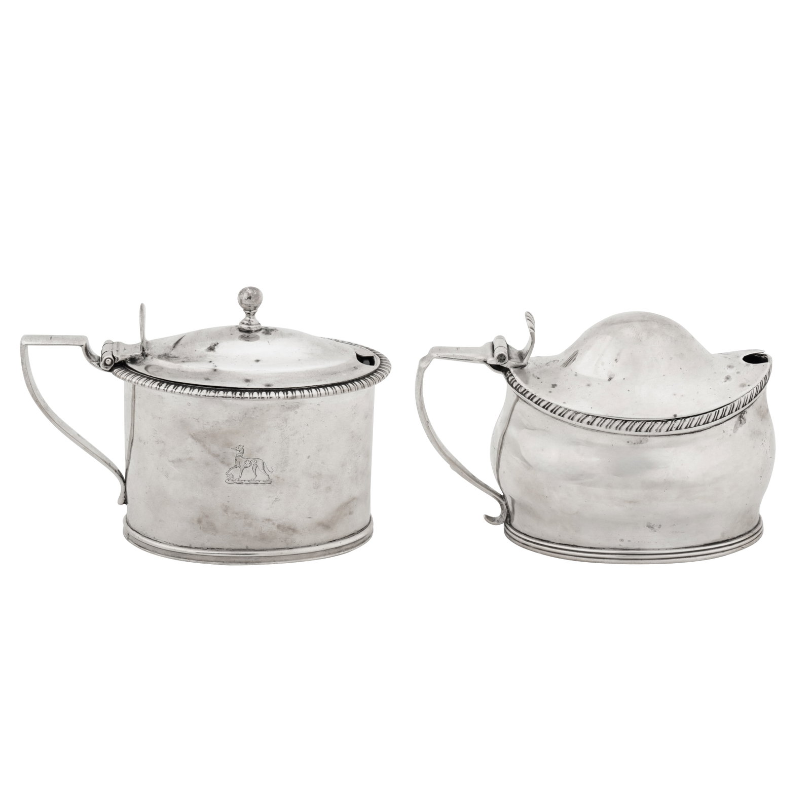 London 1805 by John Emes A George III sterling silver mustard pot: London 1805 by John Emes A George III sterling silver mustard pot Of oval cylindrical form with a gadrooned rim, D section handle leading to a hinged domed lid surmounted by a ball finial. Removable b