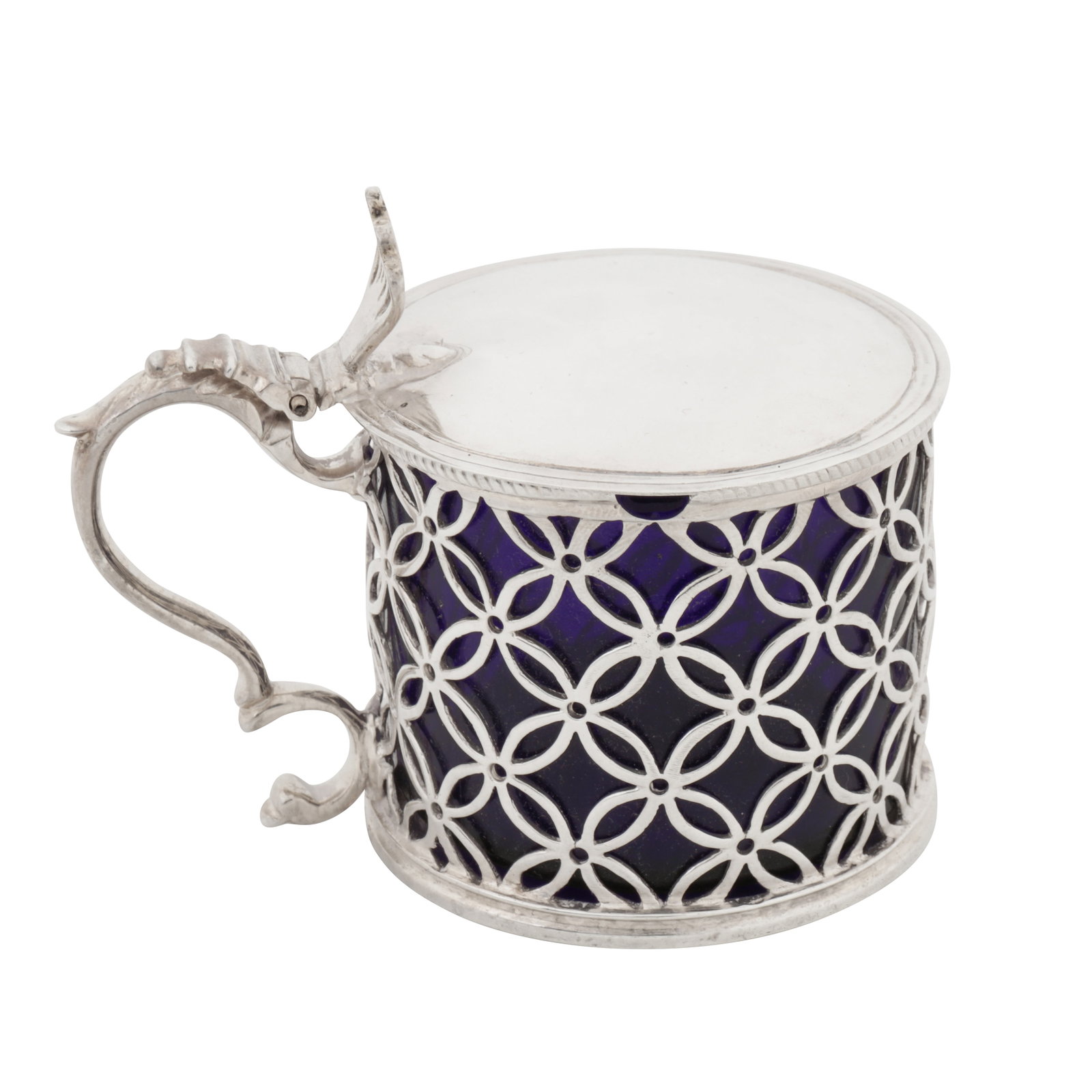London 1766 by Solomon Howland (reg. 13th Sep 1760) A George III sterling silver mustard pot: London 1766 by Solomon Howland (reg. 13th Sep 1760) A George III sterling silver mustard pot Of cylindrical ‘drum’ form with a double C scroll handle leading to a hinged gently domed lid raised by