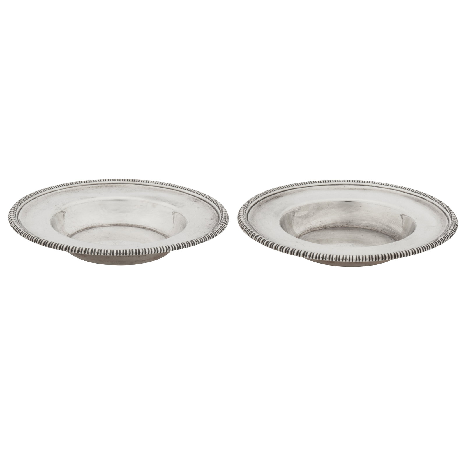Birmingham 1807 by Matthew Boulton A pair of George III sterling silver salts dishes: Birmingham 1807 by Matthew Boulton A pair of George III sterling silver salts dishes Each of dished circular form with gadrooned rims. Each fully marked underneath. (2) Diameter - 10.3 cm / 4.025 inch