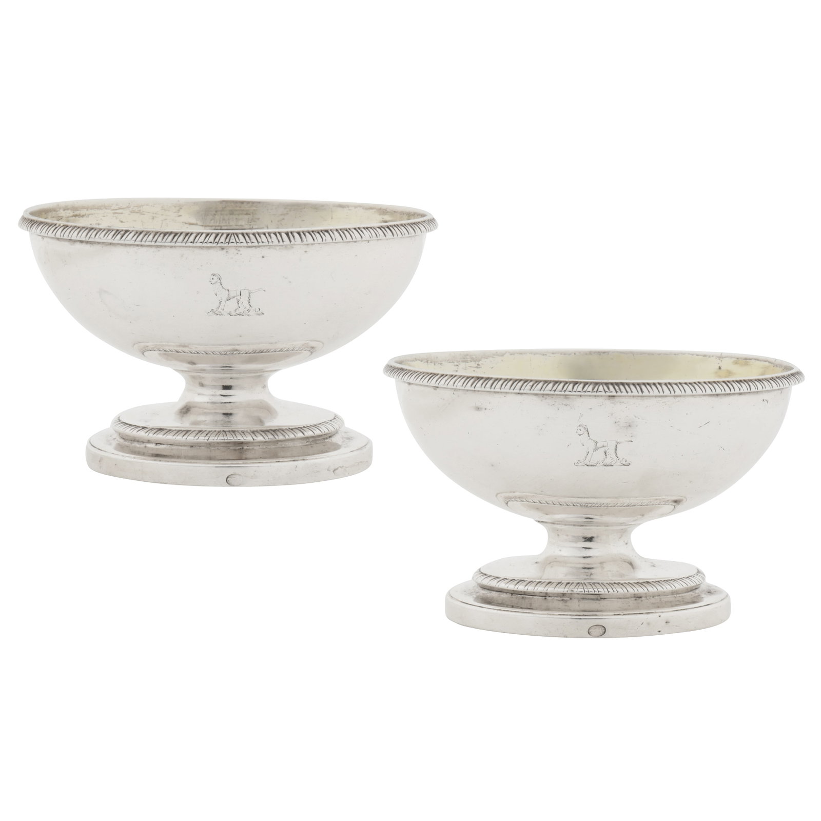 London 1791 by John Wakelin and William Taylor (reg. 25th Sep 1776) A pair of George III sterling: London 1791 by John Wakelin and William Taylor (reg. 25th Sep 1776) A pair of George III sterling silver salts Of oval rounded form on a spreading oval foot, with gadrooned edge. Each engraved with a 