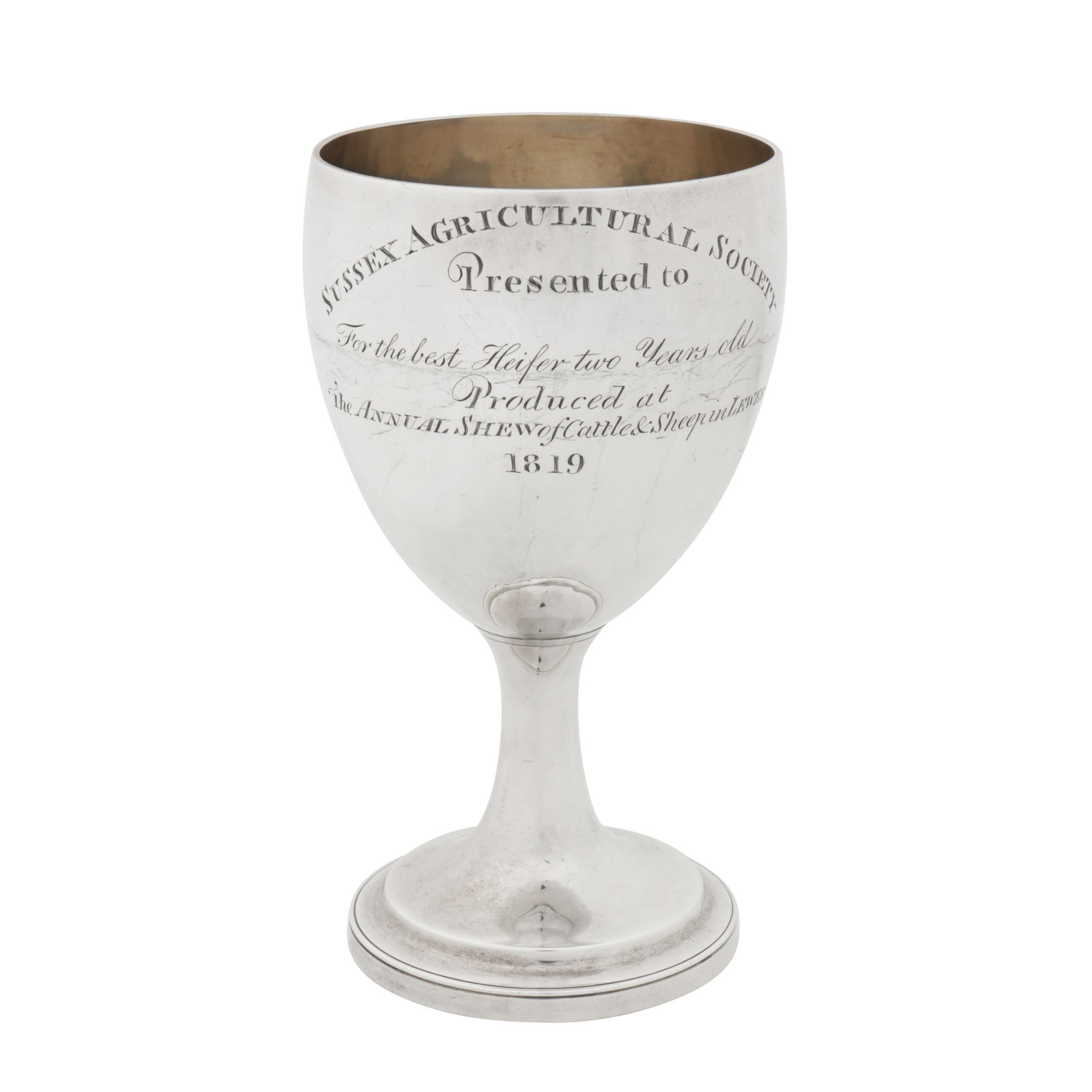 Sussex interest - London 1819 by William Bateman II A George III sterling silver wine goblet: Sussex interest - London 1819 by William Bateman II A George III sterling silver wine goblet Of rounded circular form upon a spreading circular pedestal base with a stepped edge. Engraved to the side 