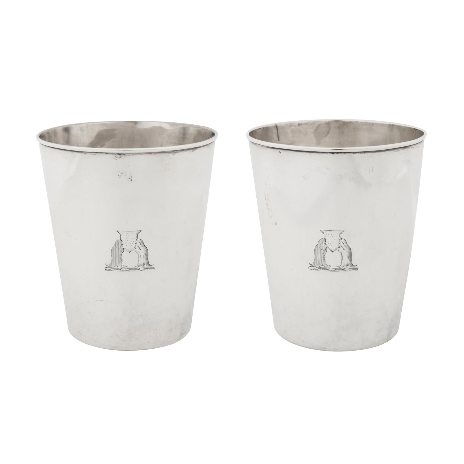 London 1801 by John Robins (reg. 20th Oct 1774) A pair of George III sterling silver beakers: London 1801 by John Robins (reg. 20th Oct 1774) A pair of George III sterling silver beakers each of tapering cylindrical form with moulded rims. Each engraved with a crest of two lion’s gamb erased